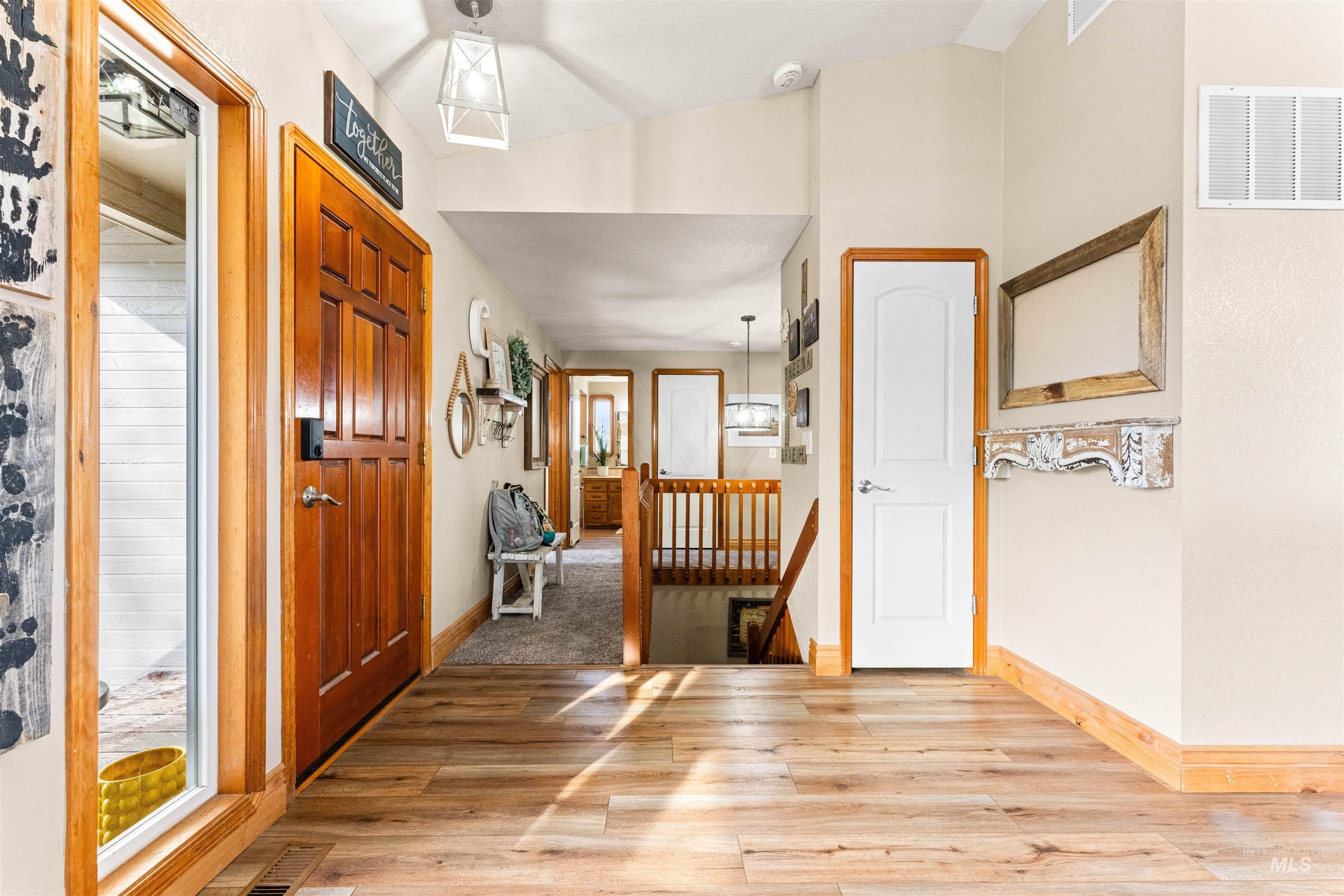 Entryway featuring light wood finished floors and baseboards