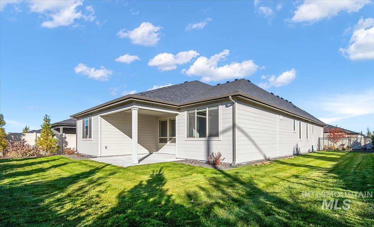 Rear view of property featuring a patio area