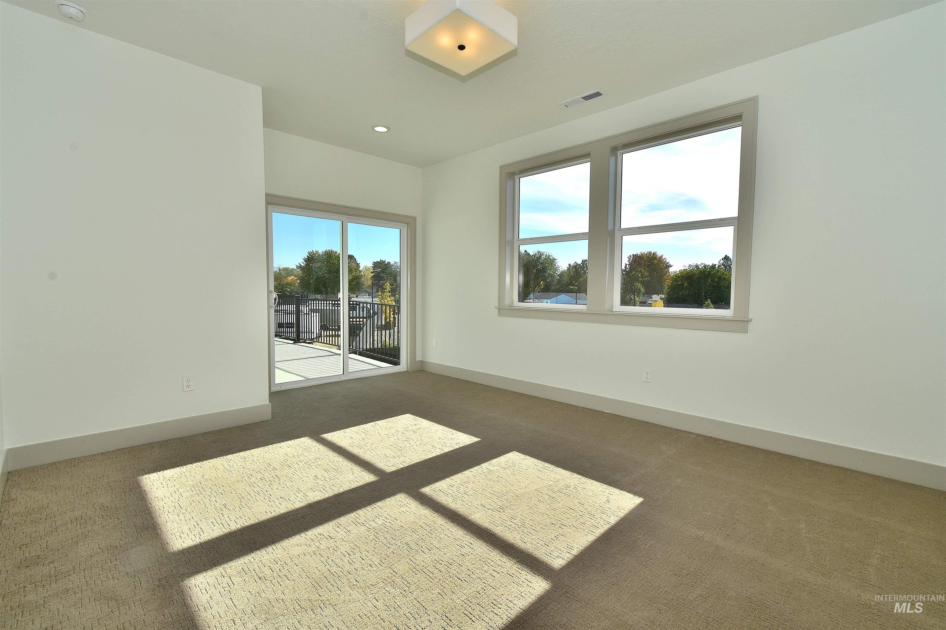 2nd upstairs bedroom out to large patio