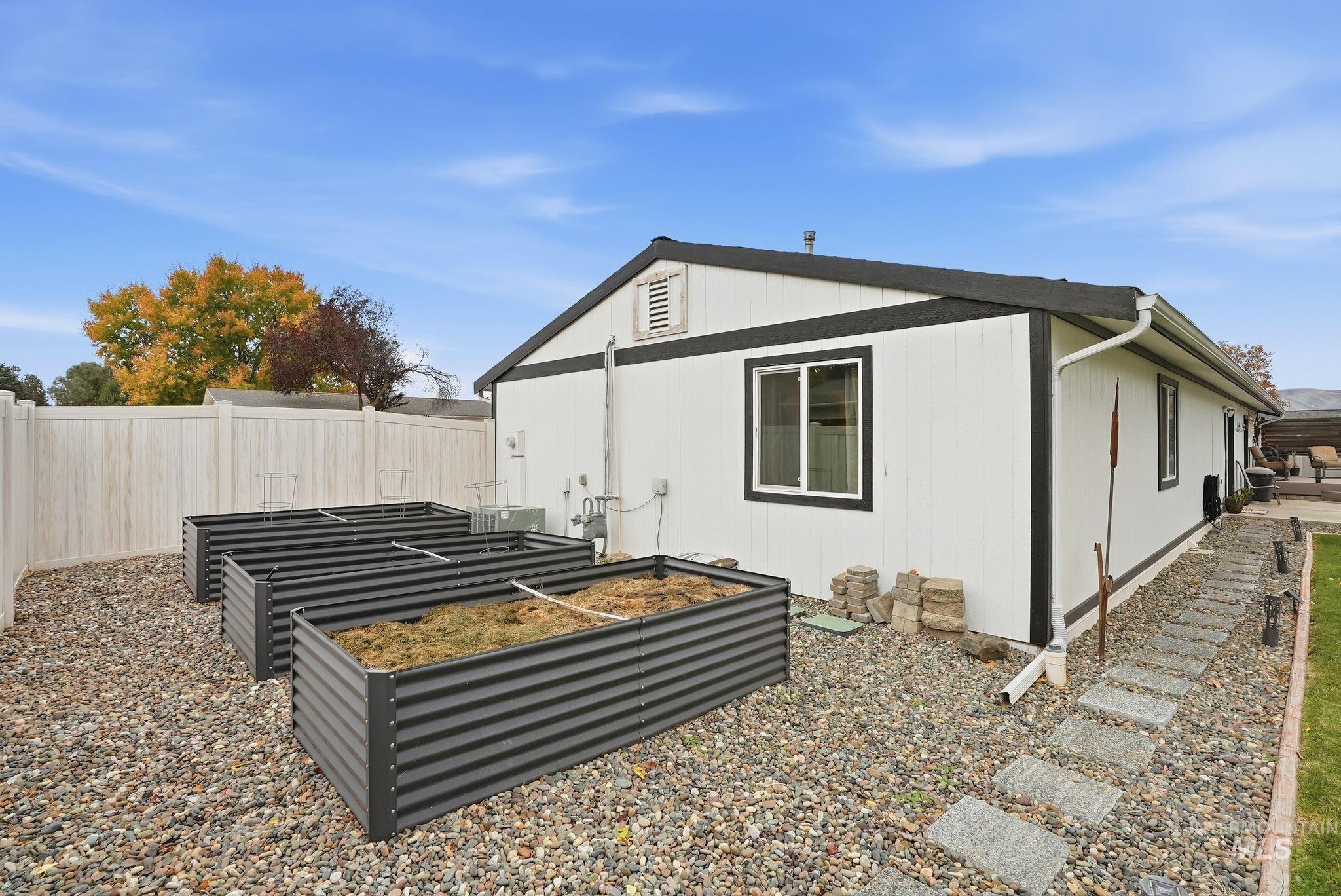 View of home's exterior featuring a vegetable garden