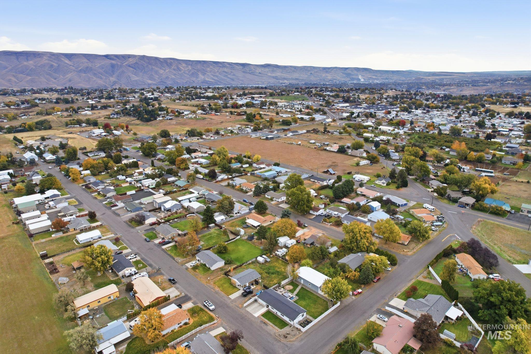 View of property location featuring a mountain backdrop and nearby suburban area