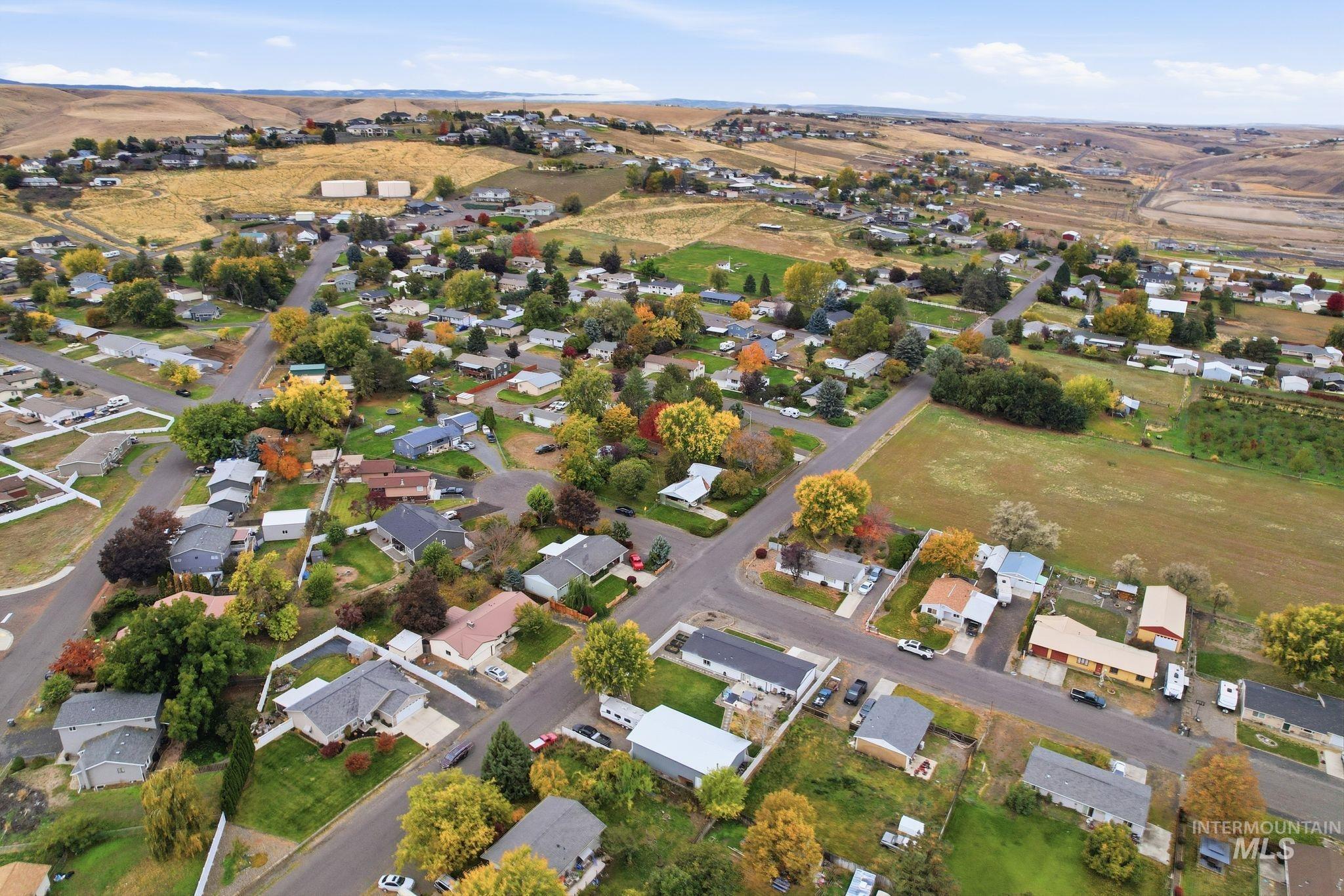 View of property location with nearby suburban area