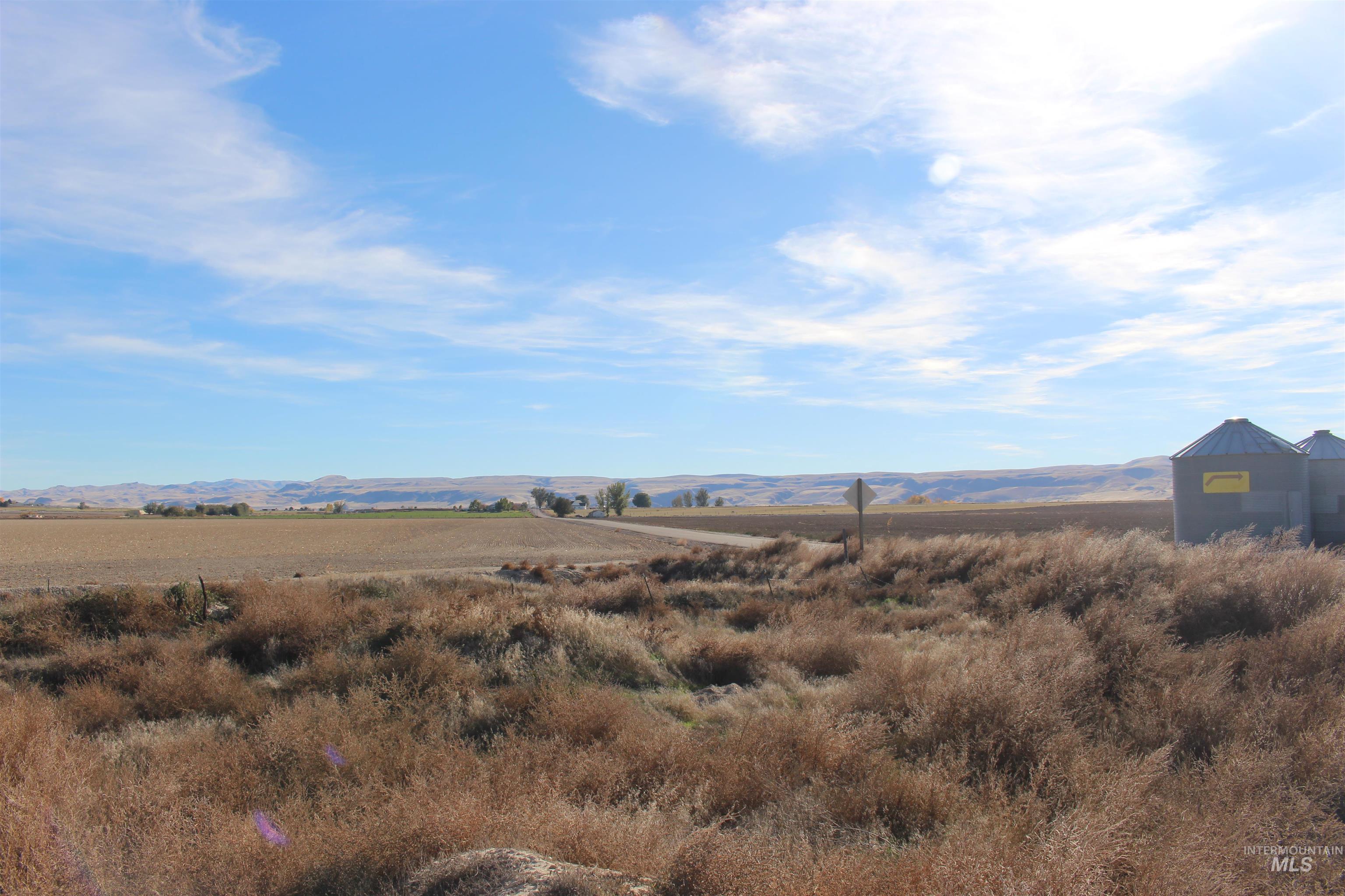 View of mountain background featuring rural landscape