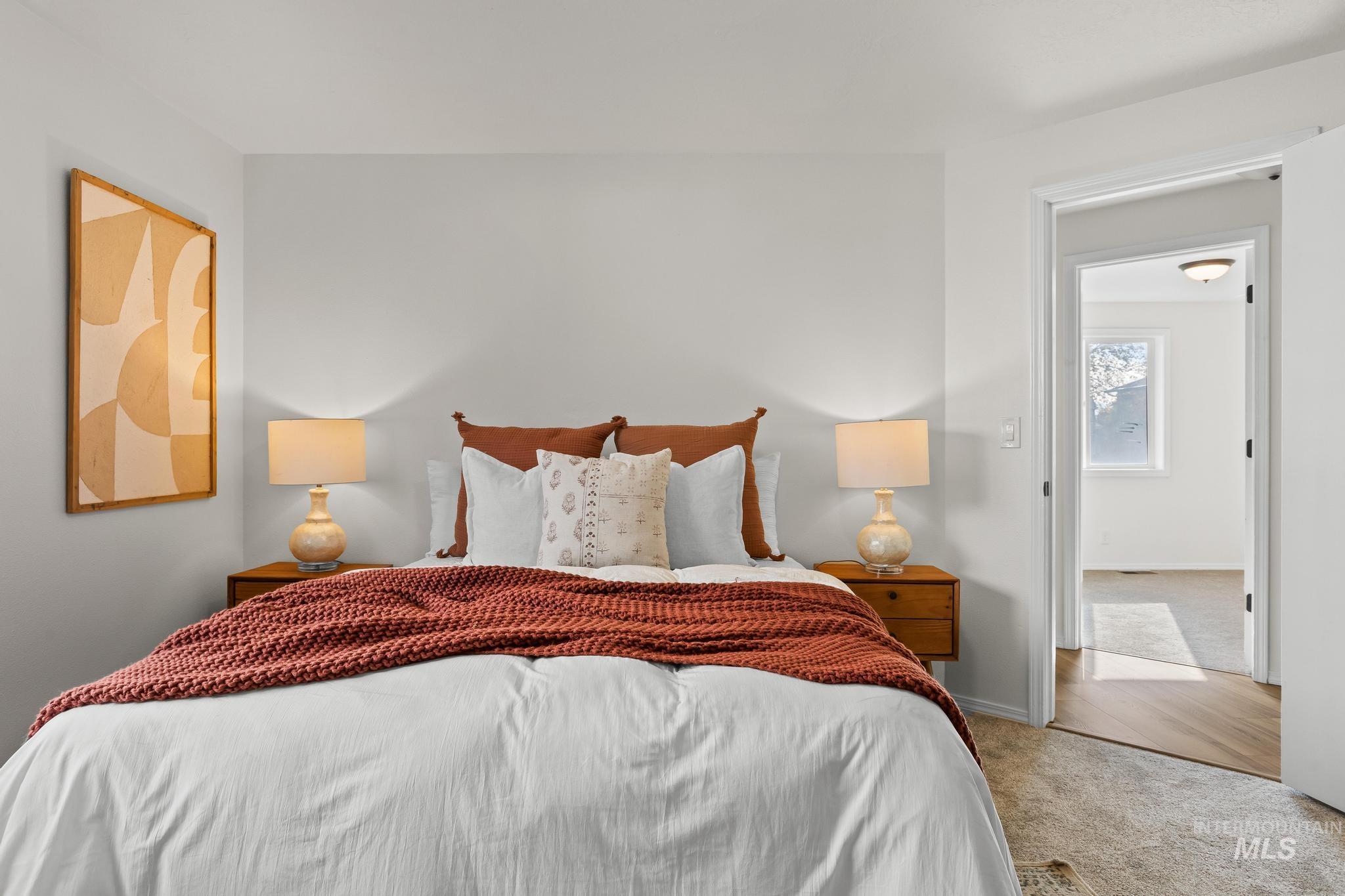Bedroom with carpet floors and baseboards
