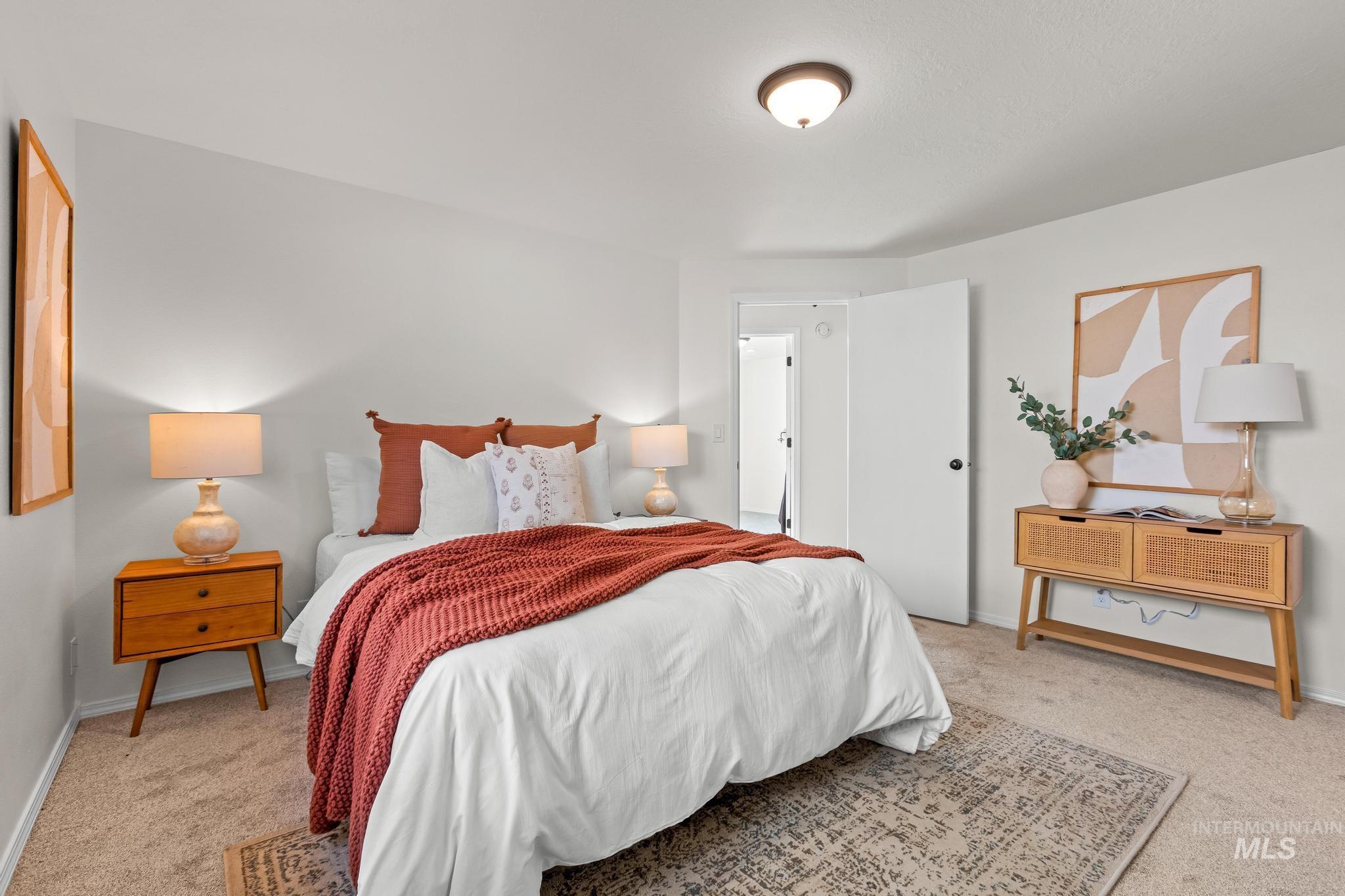 Bedroom with light colored carpet