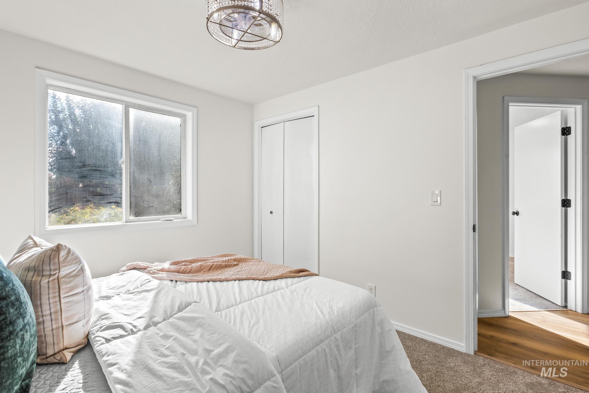 Bedroom featuring carpet floors and a closet