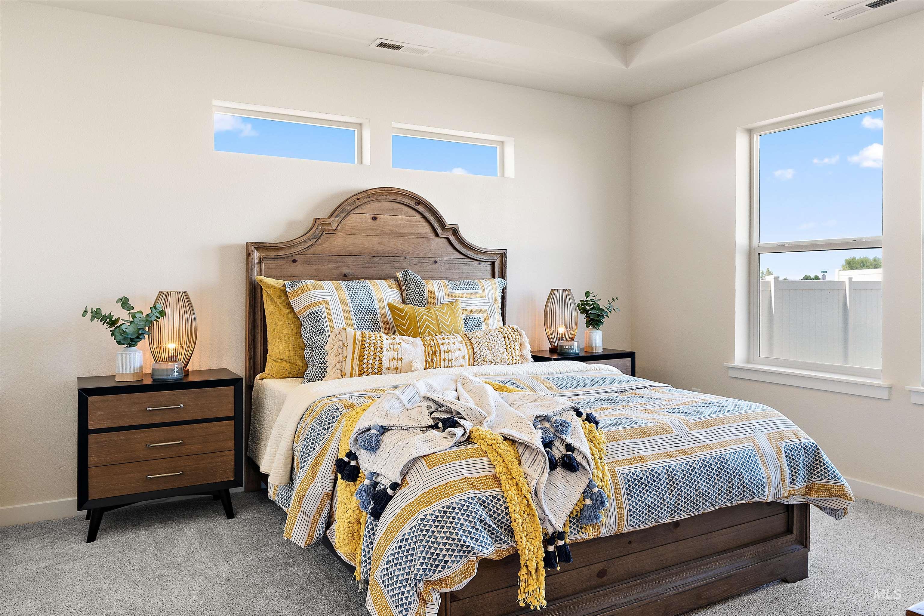 Carpeted bedroom with baseboards
