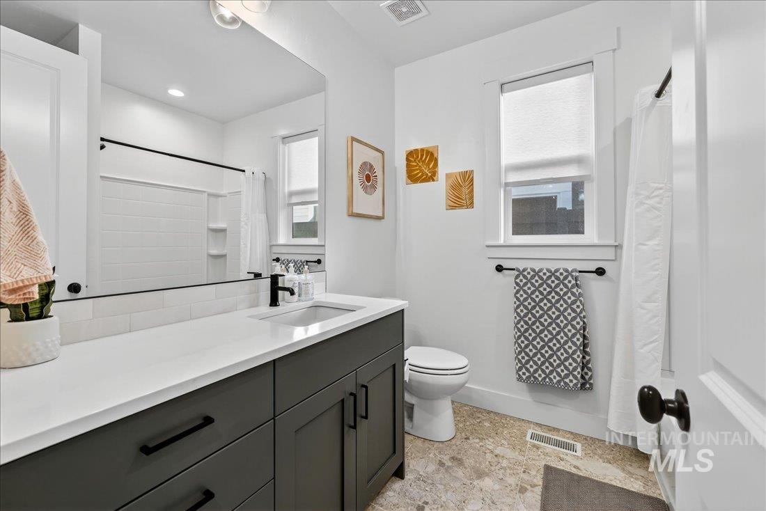 Bathroom featuring vanity and a shower with shower curtain