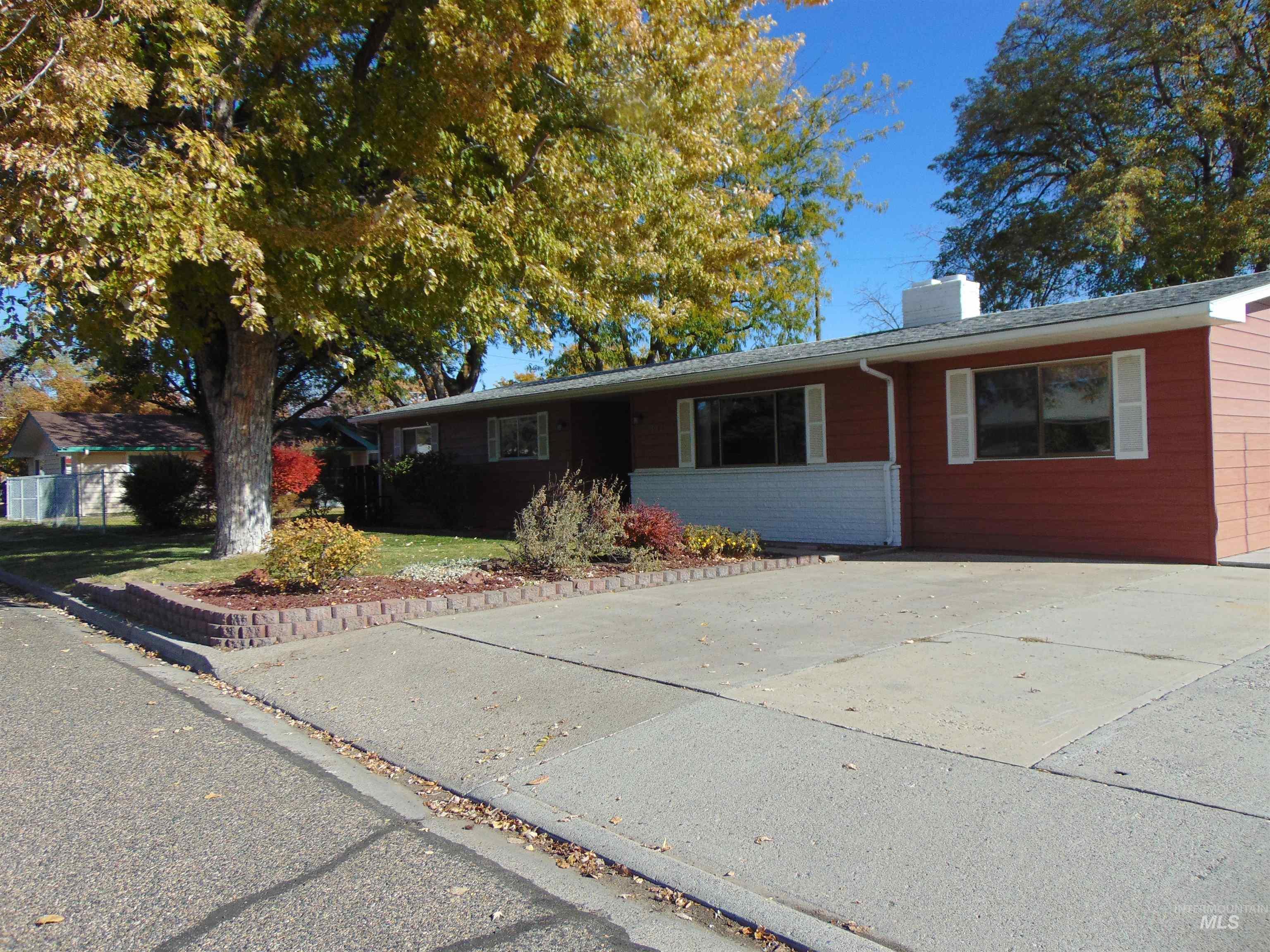Ranch-style home with a chimney