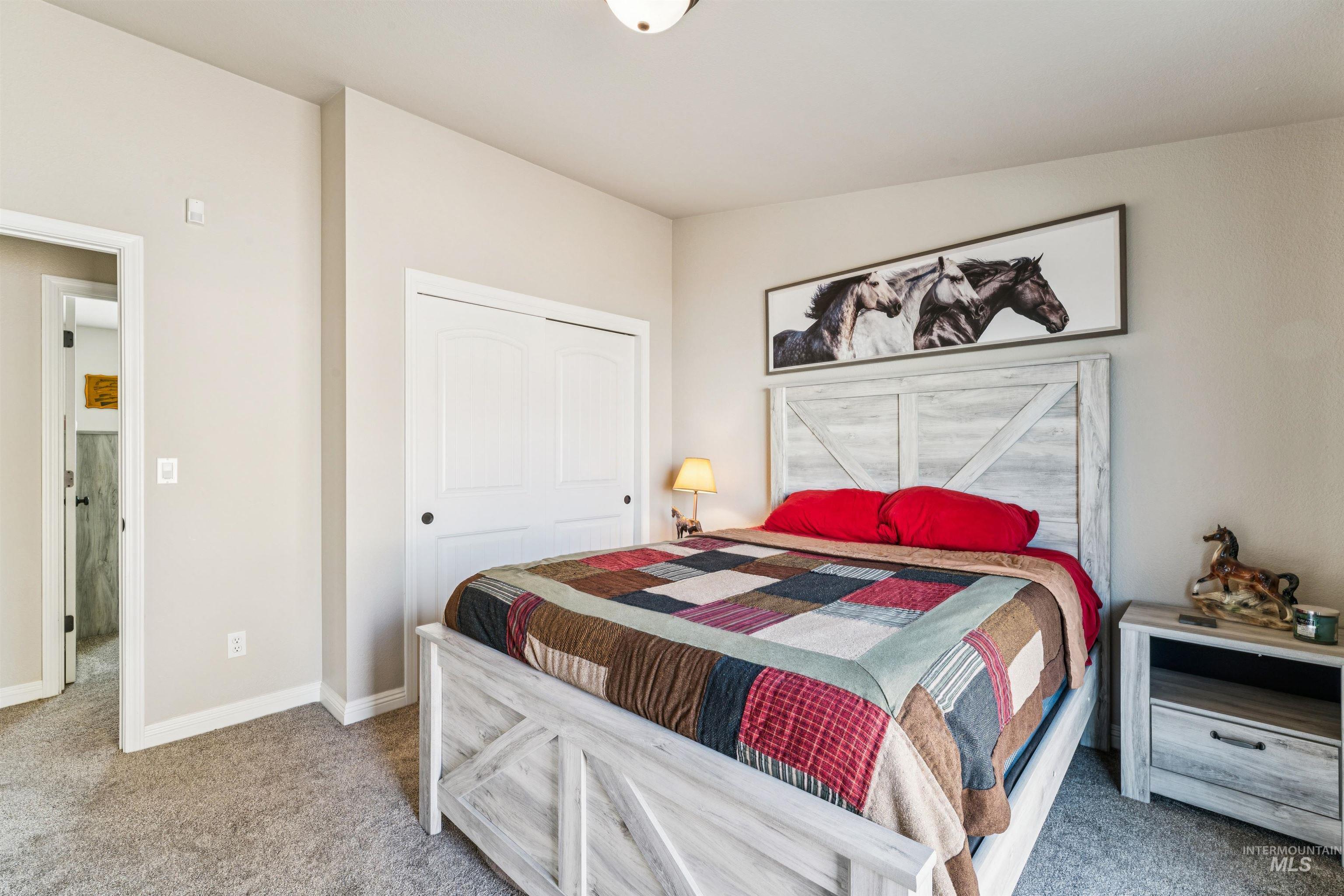 Bedroom with carpet and a closet