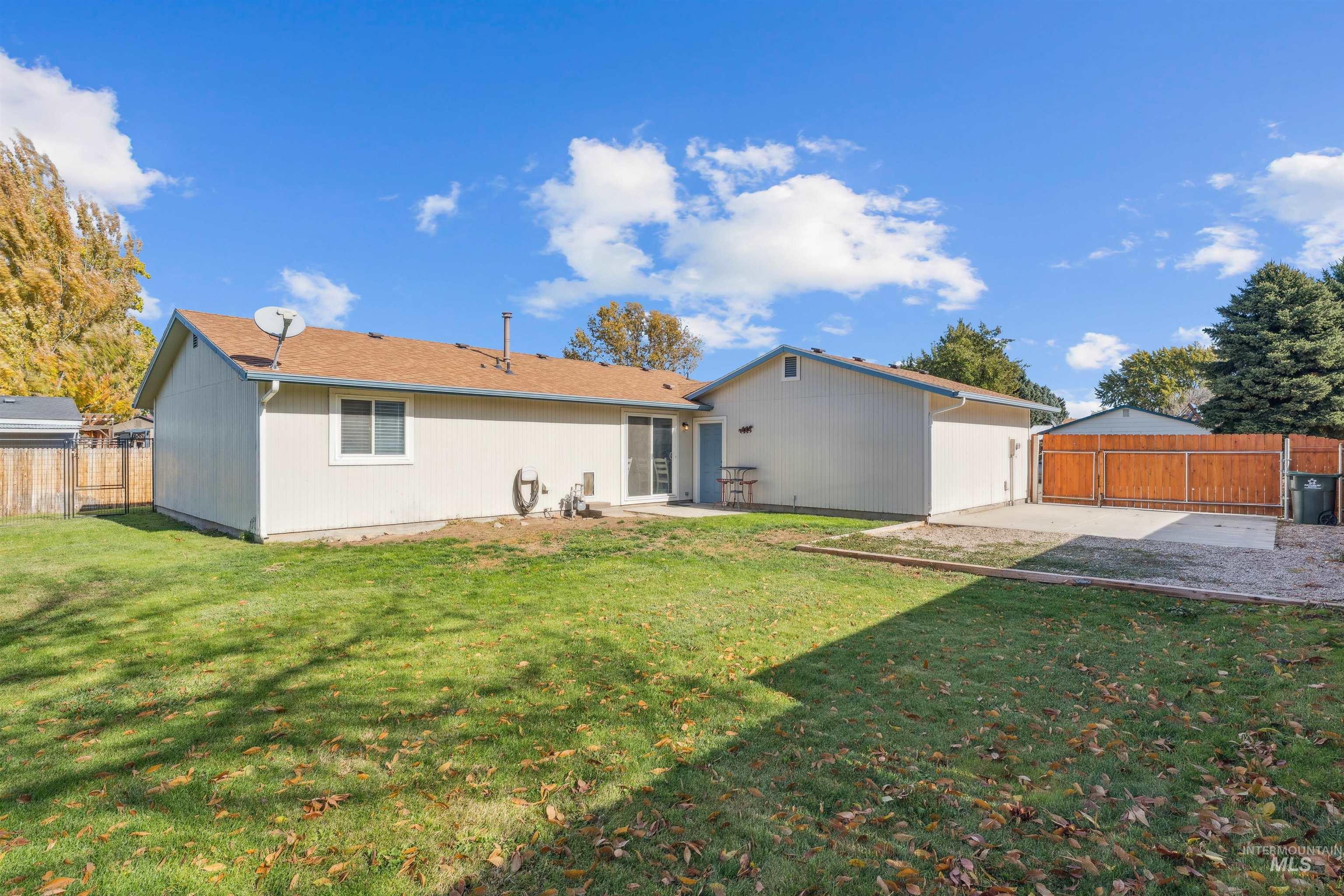 Back of house featuring a fenced backyard and a patio