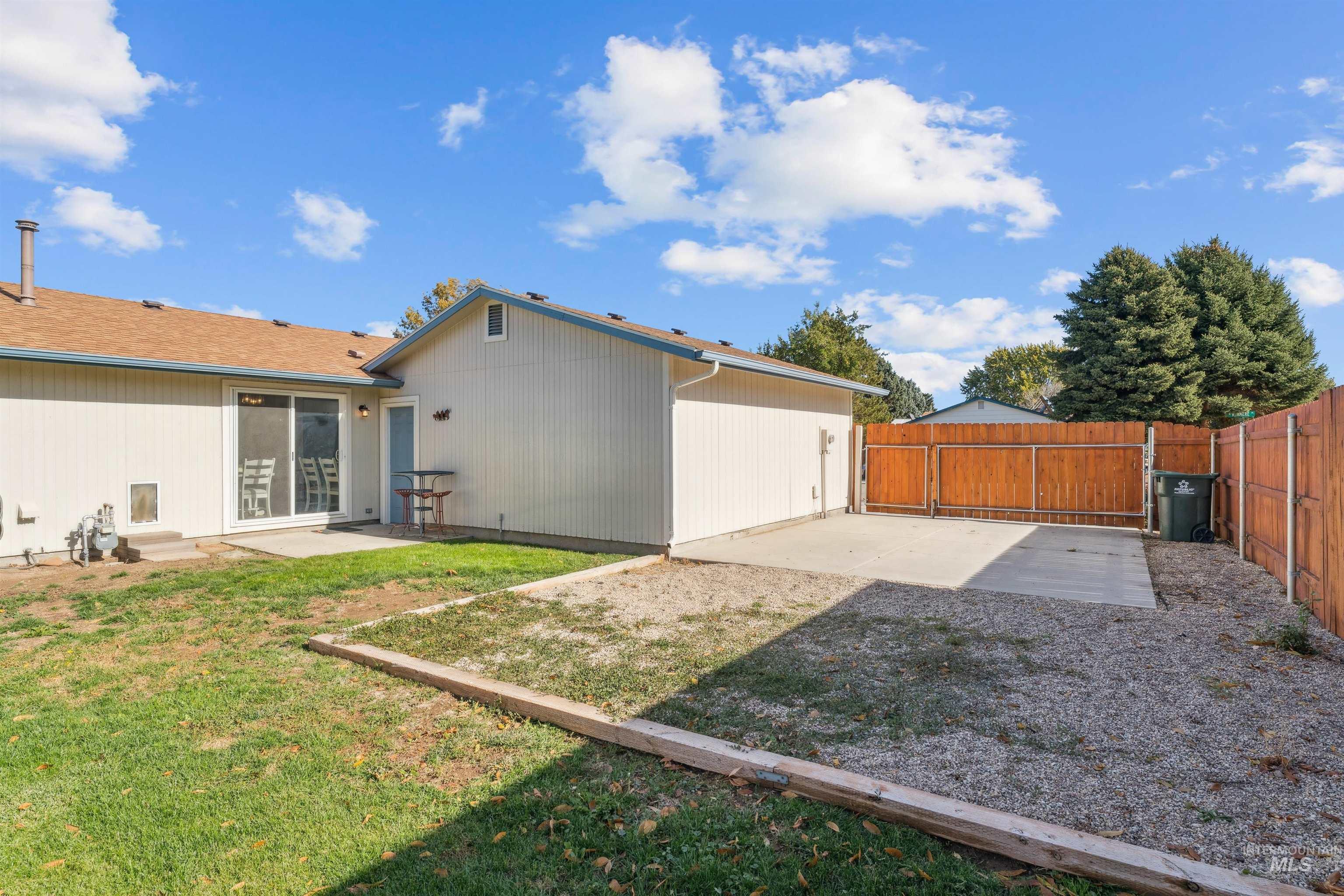Rear view of property with a patio and a fenced backyard