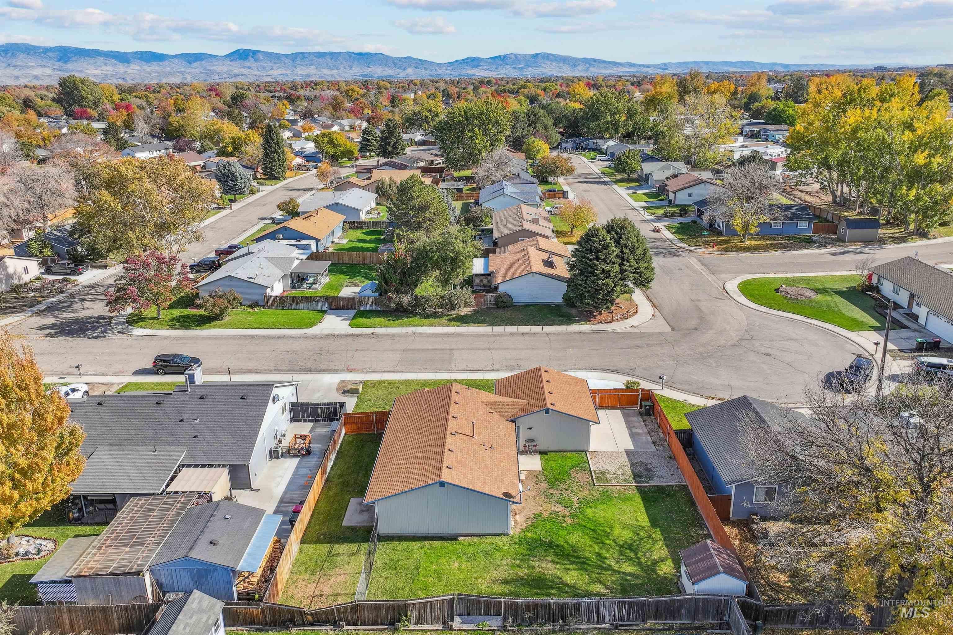 Aerial view of residential area featuring mountains
