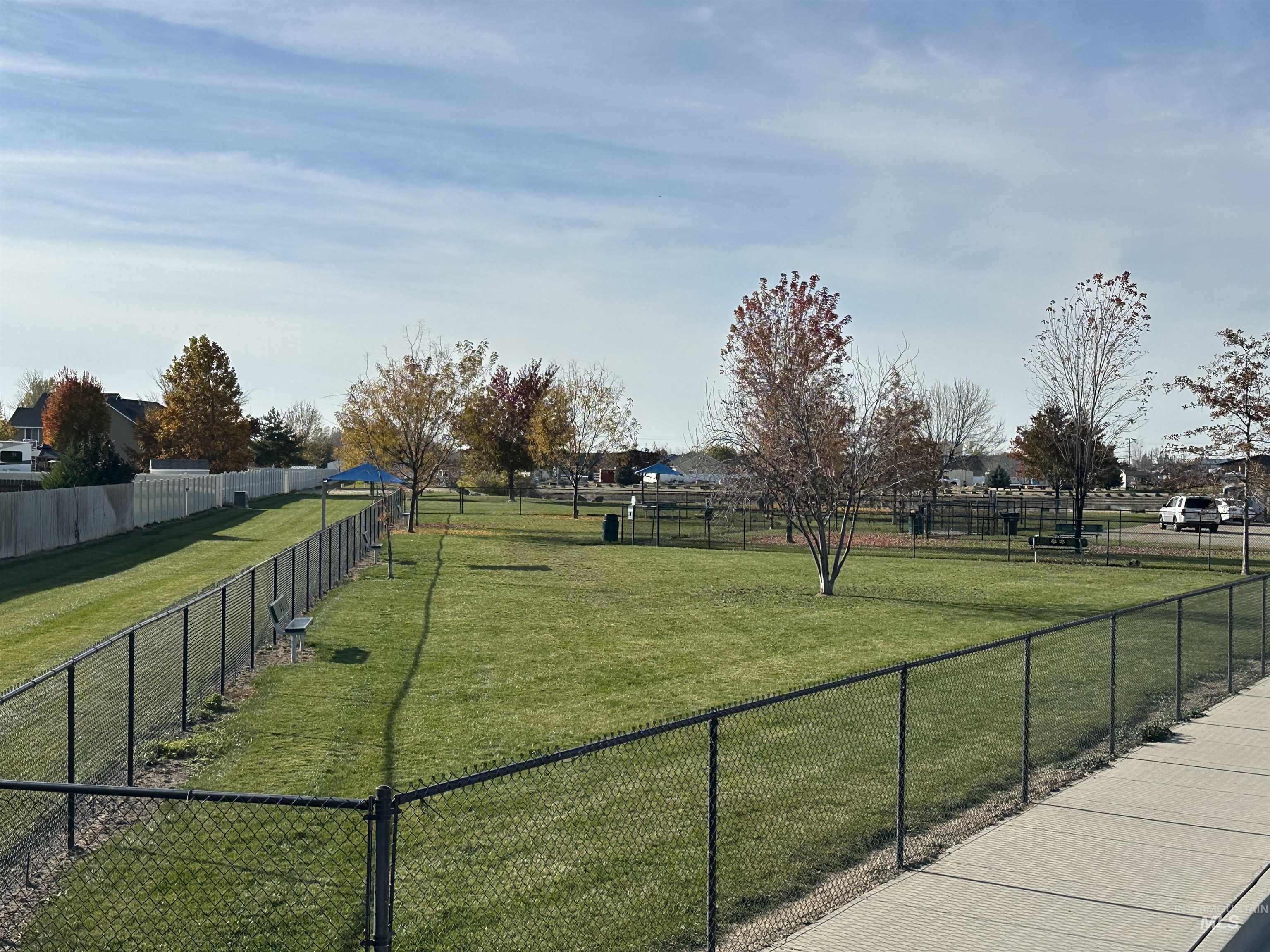 Mudroom featuring dark wood-style flooring and baseboards