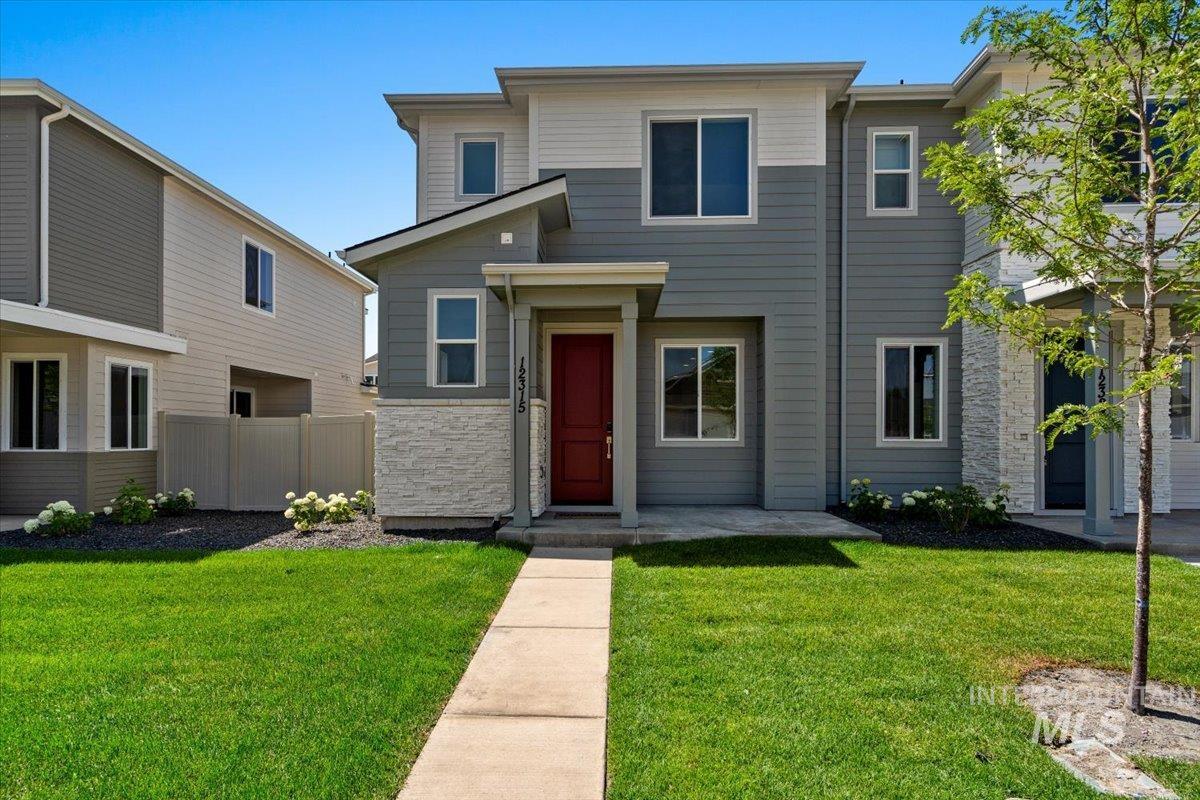 View of front of property with stone siding