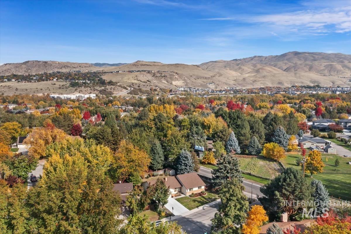 Aerial overview of property's location with a mountain backdrop