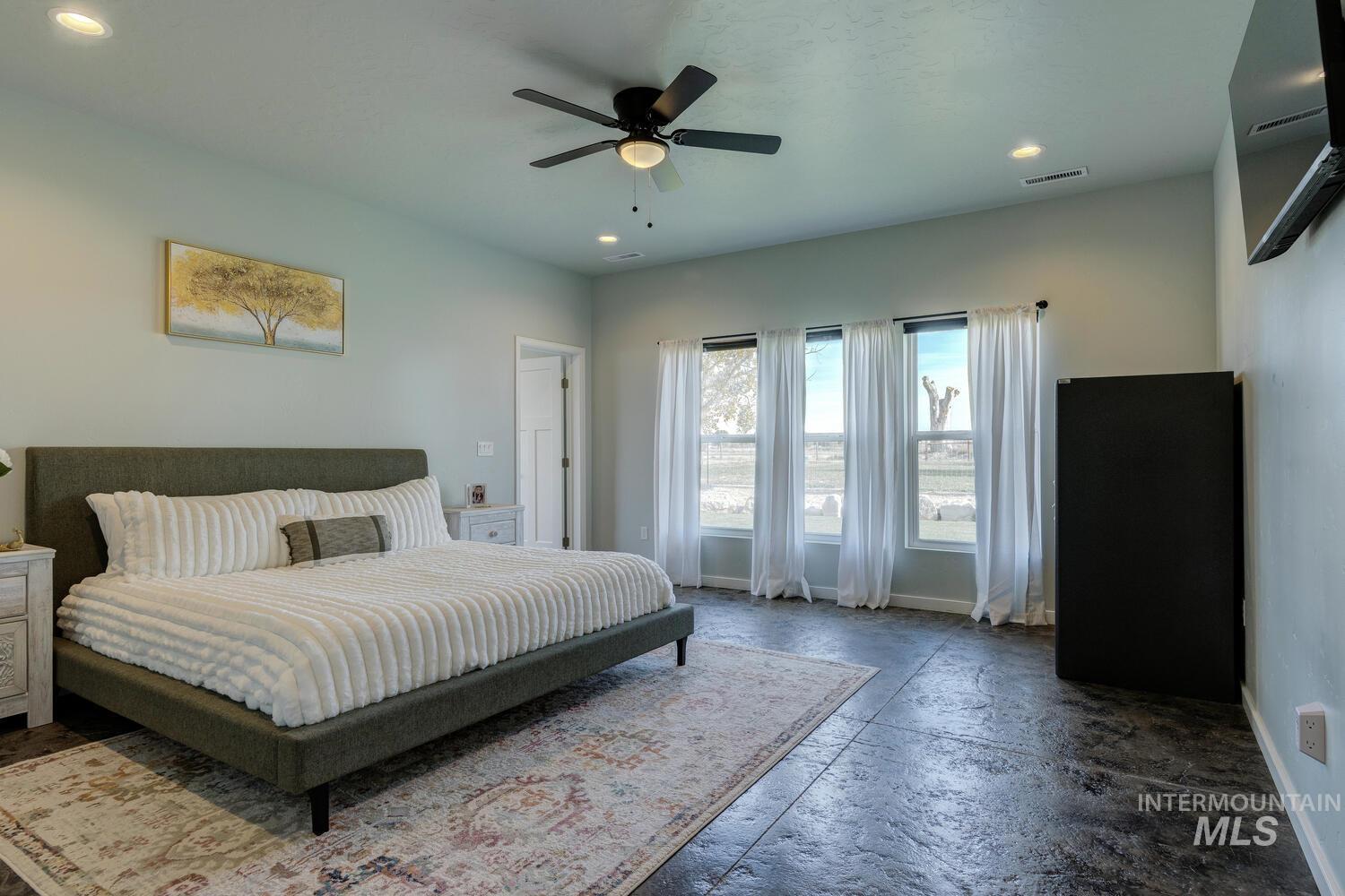 Bedroom featuring recessed lighting and a ceiling fan