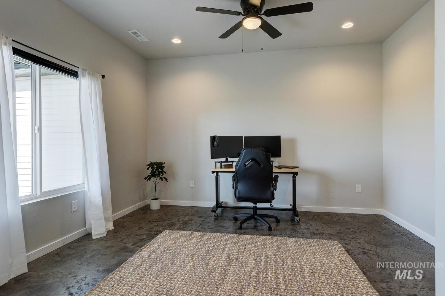 Home office with recessed lighting and a ceiling fan
