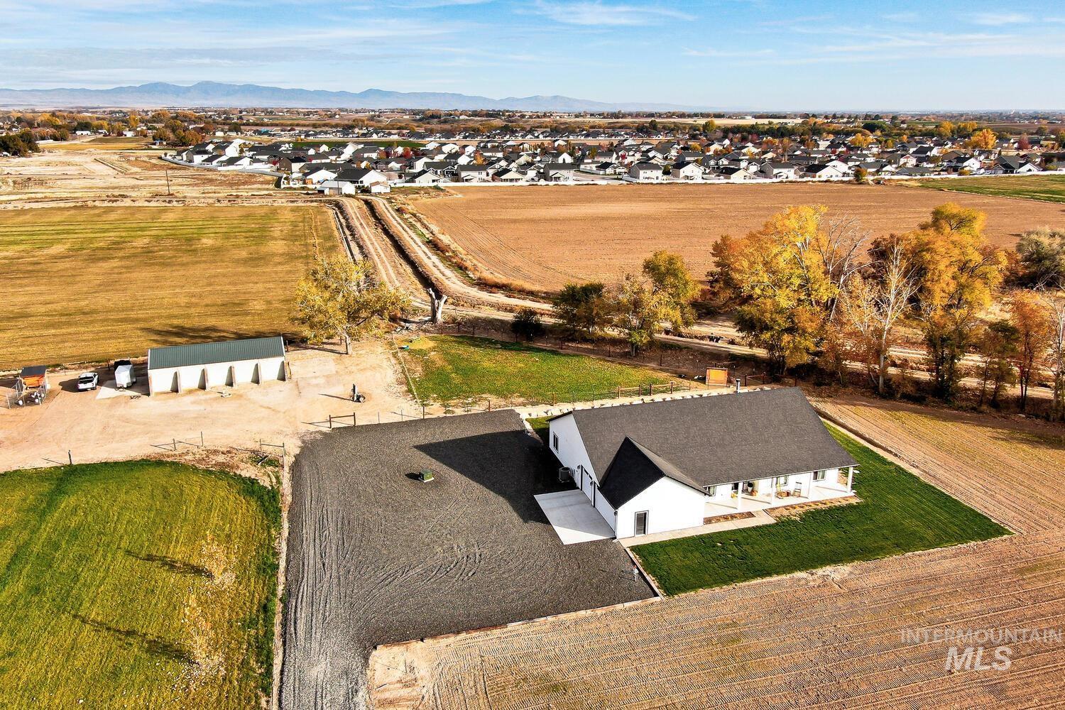 Aerial view of residential area with a mountainous background