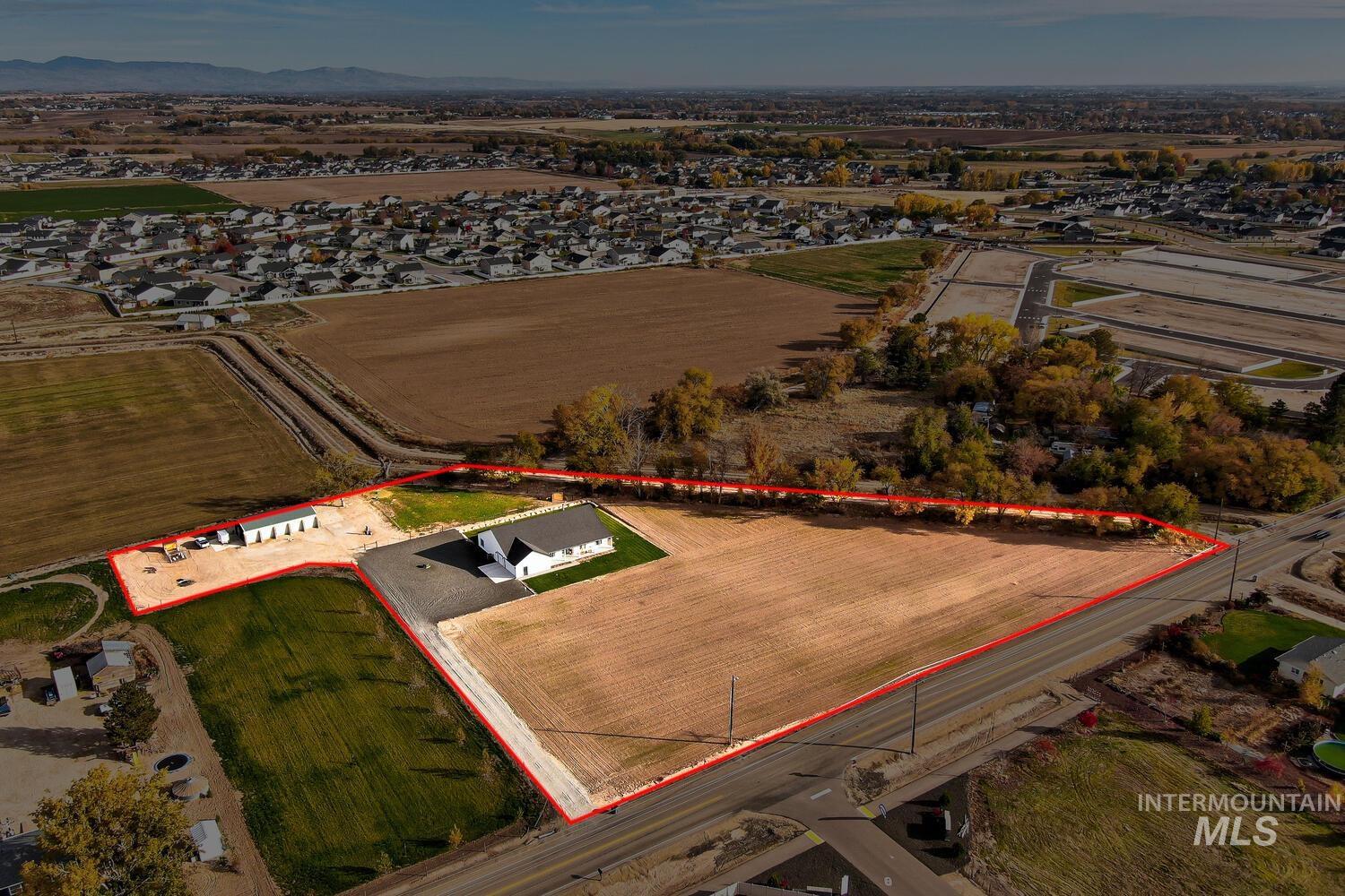 Aerial view of sparsely populated area with property boundaries highlighted