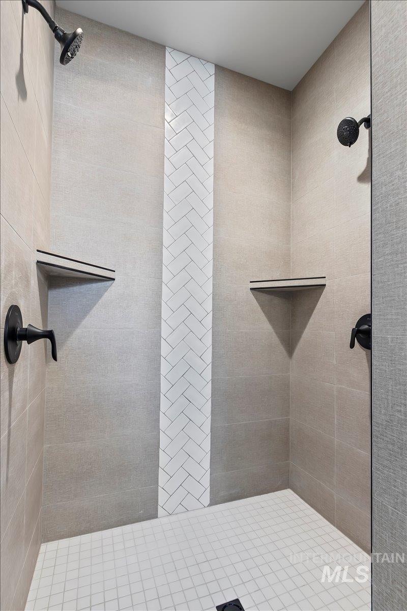 Full bath with a tile shower