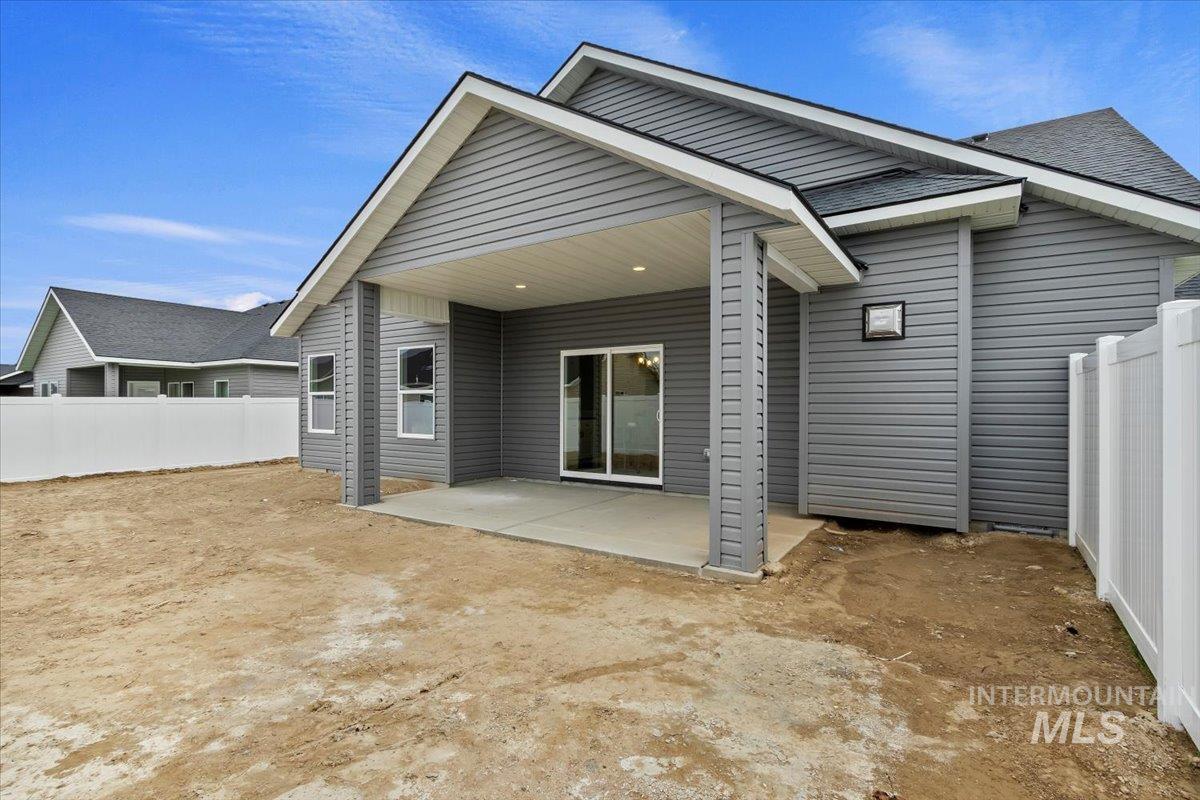 Rear view of property featuring a patio area