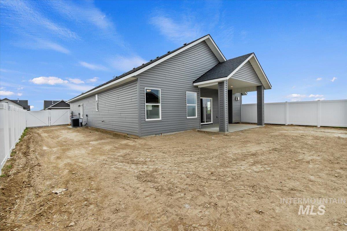 Back of house featuring a patio area and a fenced backyard