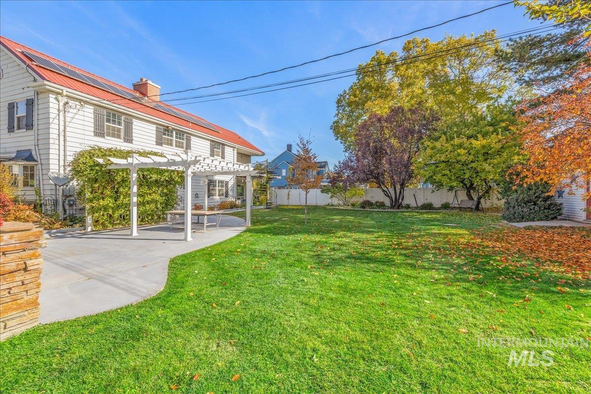 View of yard featuring a pergola and a patio area