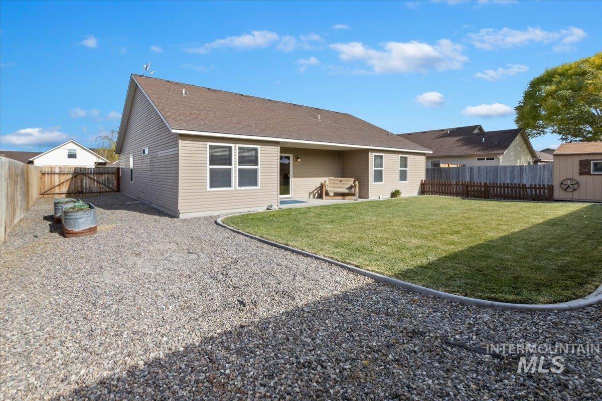 Back of house featuring a patio and a fenced backyard