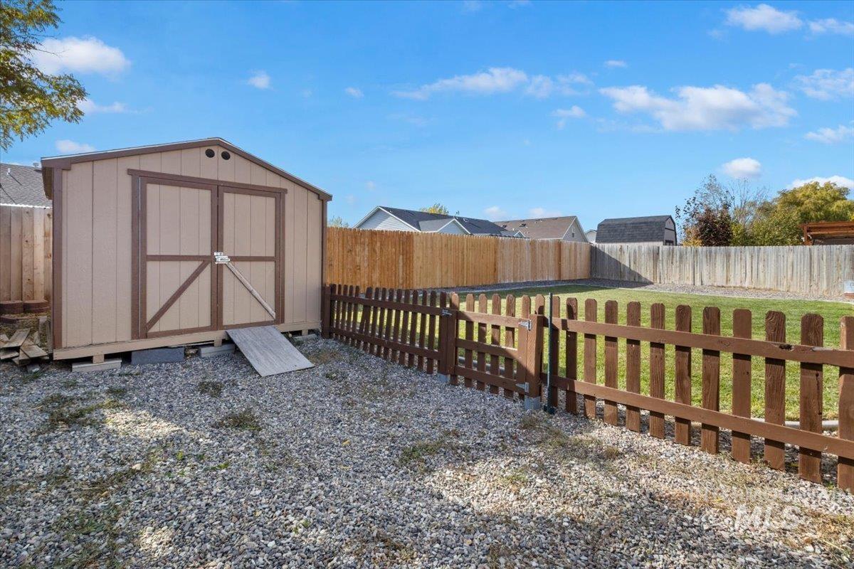 View of shed featuring a fenced backyard