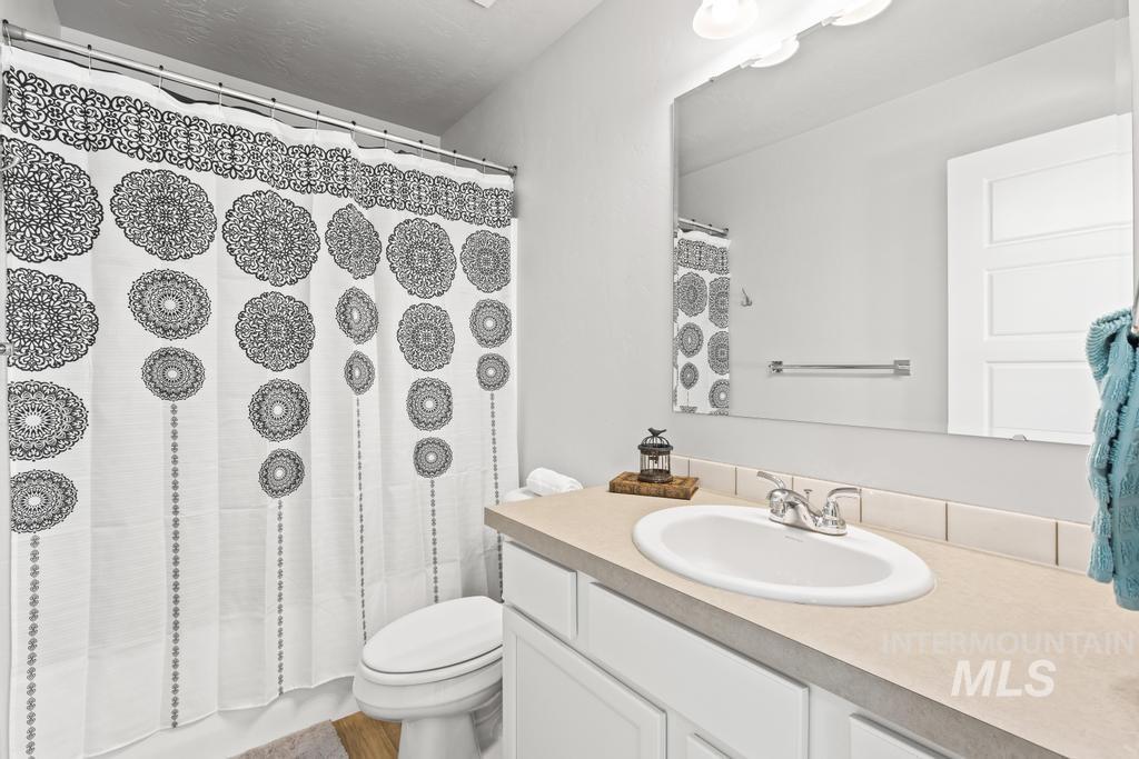 Full bath with vanity and shower / bathtub combination with curtain