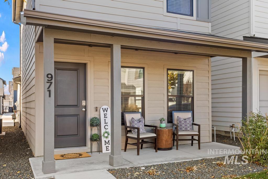Entrance to property featuring covered porch