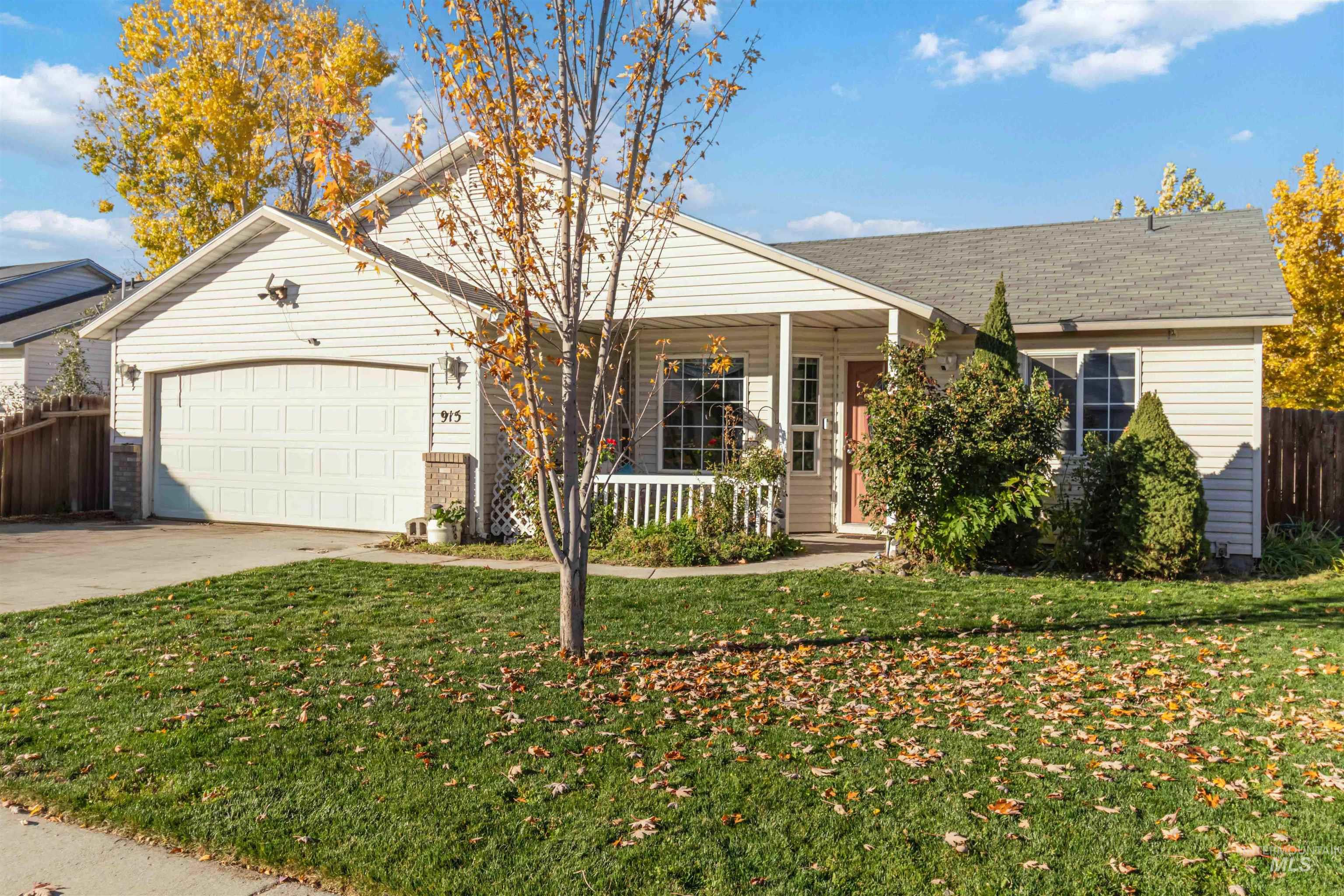 Ranch-style house with a porch, a garage, concrete driveway, and a shingled roof