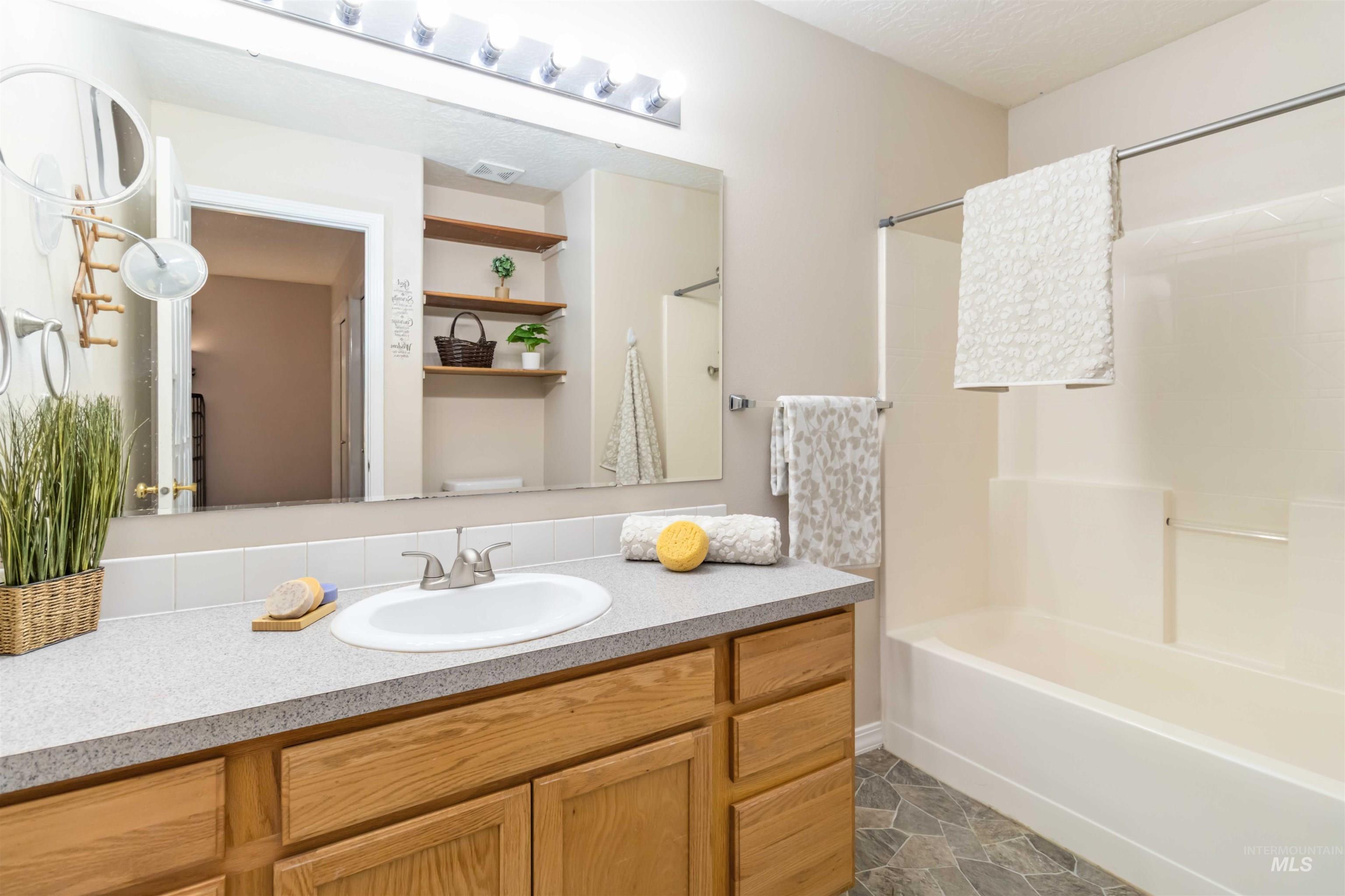 Full bathroom with vanity and shower / bathtub combination