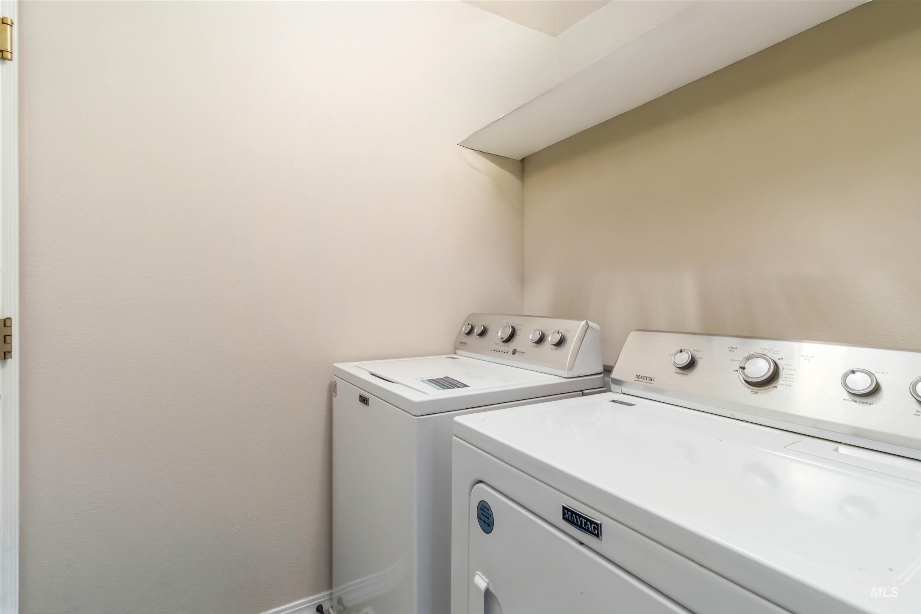 Washroom featuring separate washer and dryer