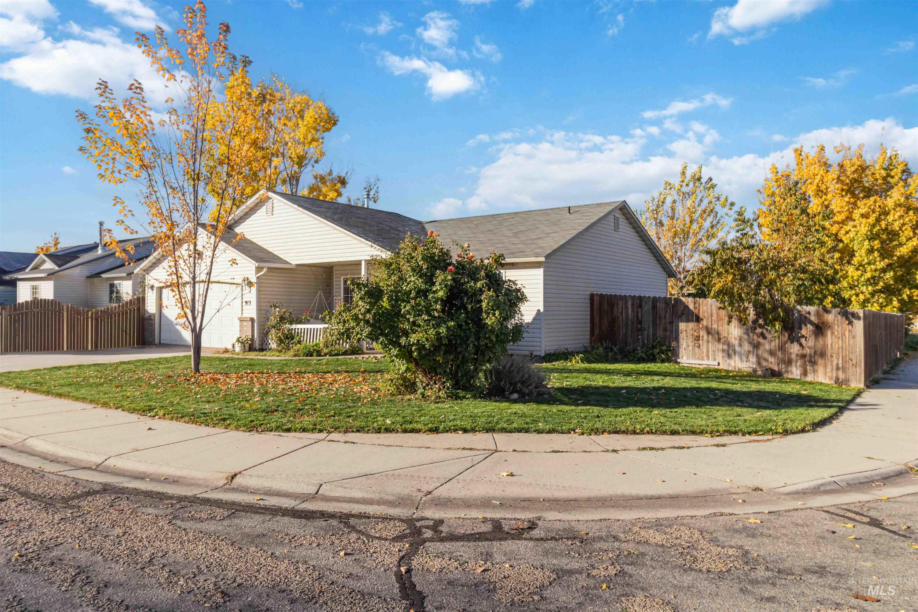 View of front of home featuring an attached garage and concrete driveway