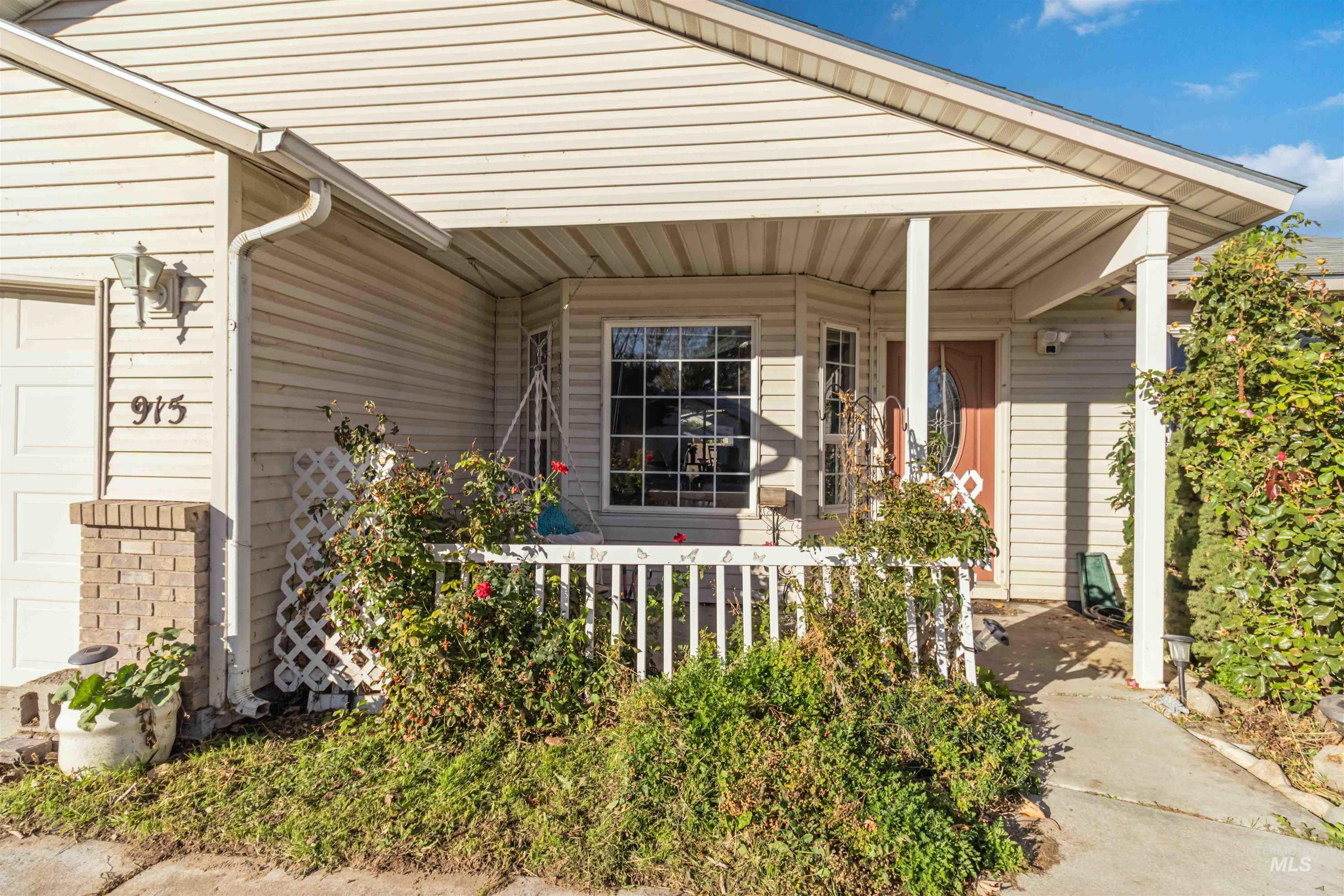 Entrance to property featuring covered porch