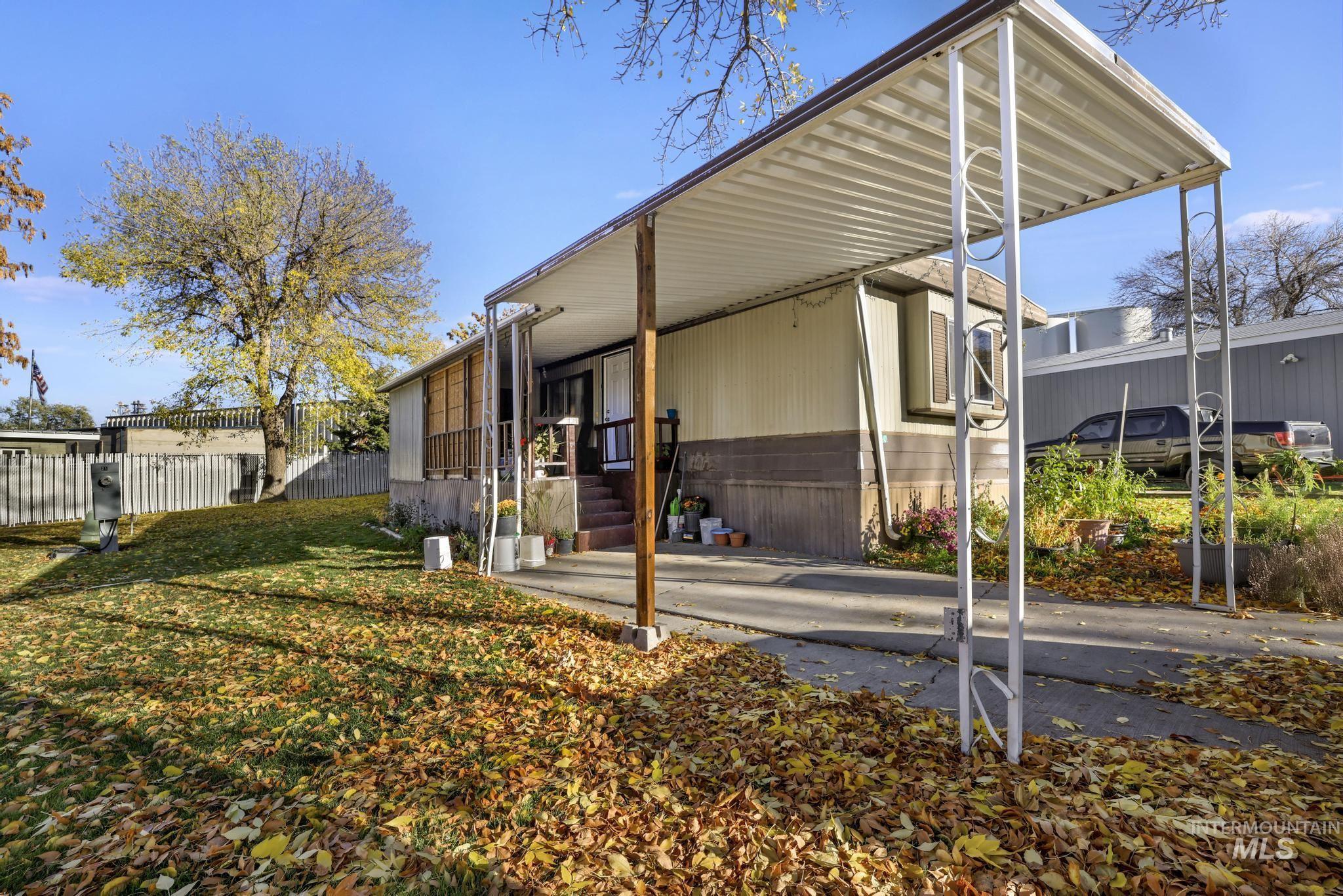 View of home's exterior with an attached carport