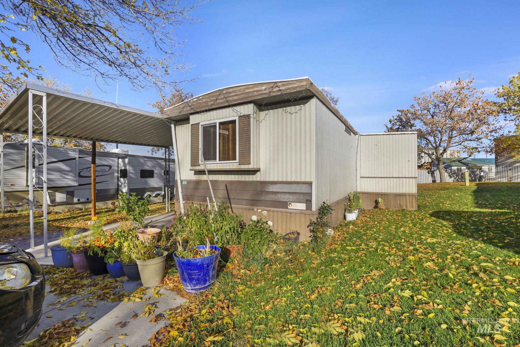 View of side of home featuring a lawn