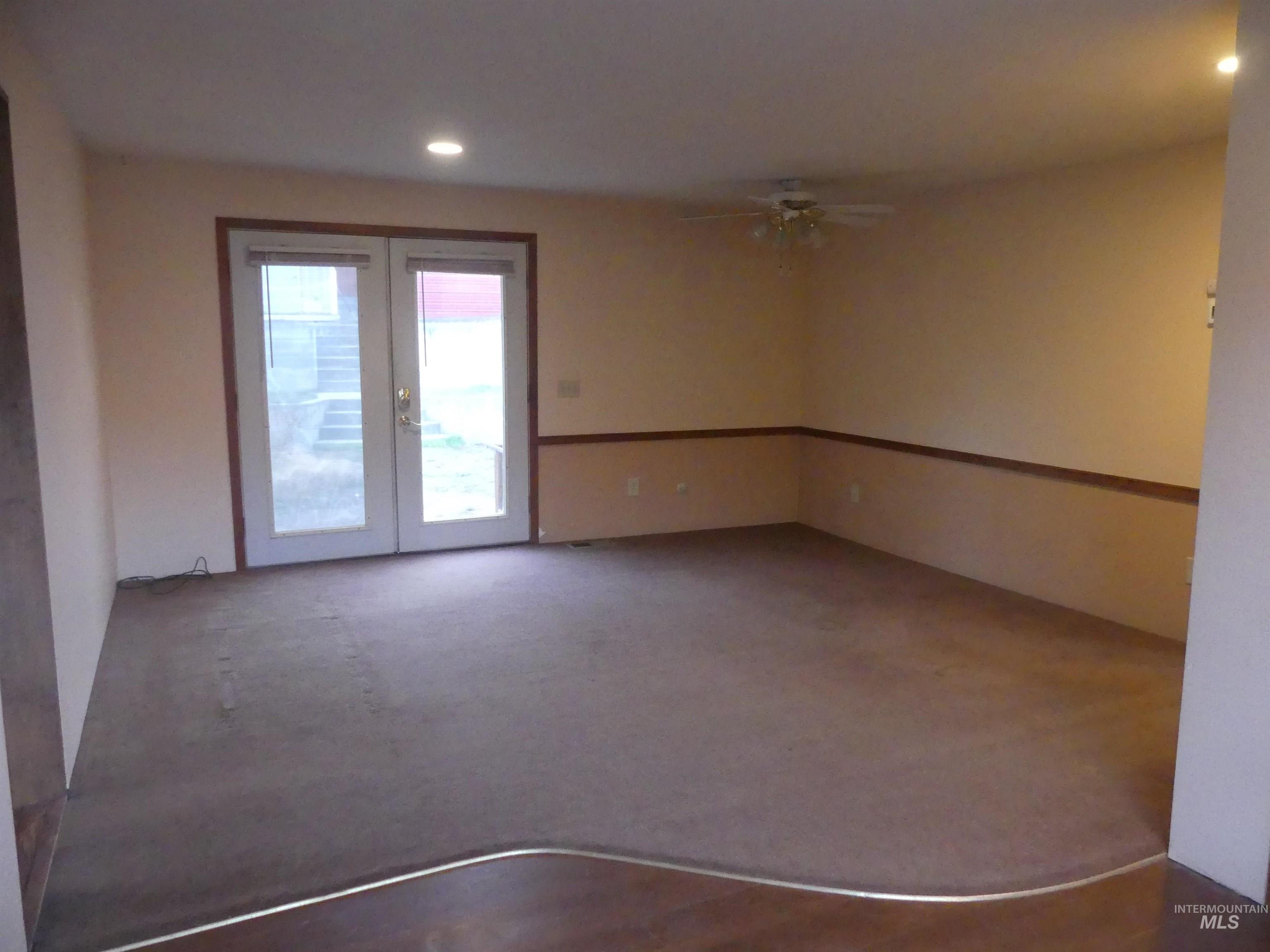Spare room with recessed lighting, french doors, a ceiling fan, and carpet