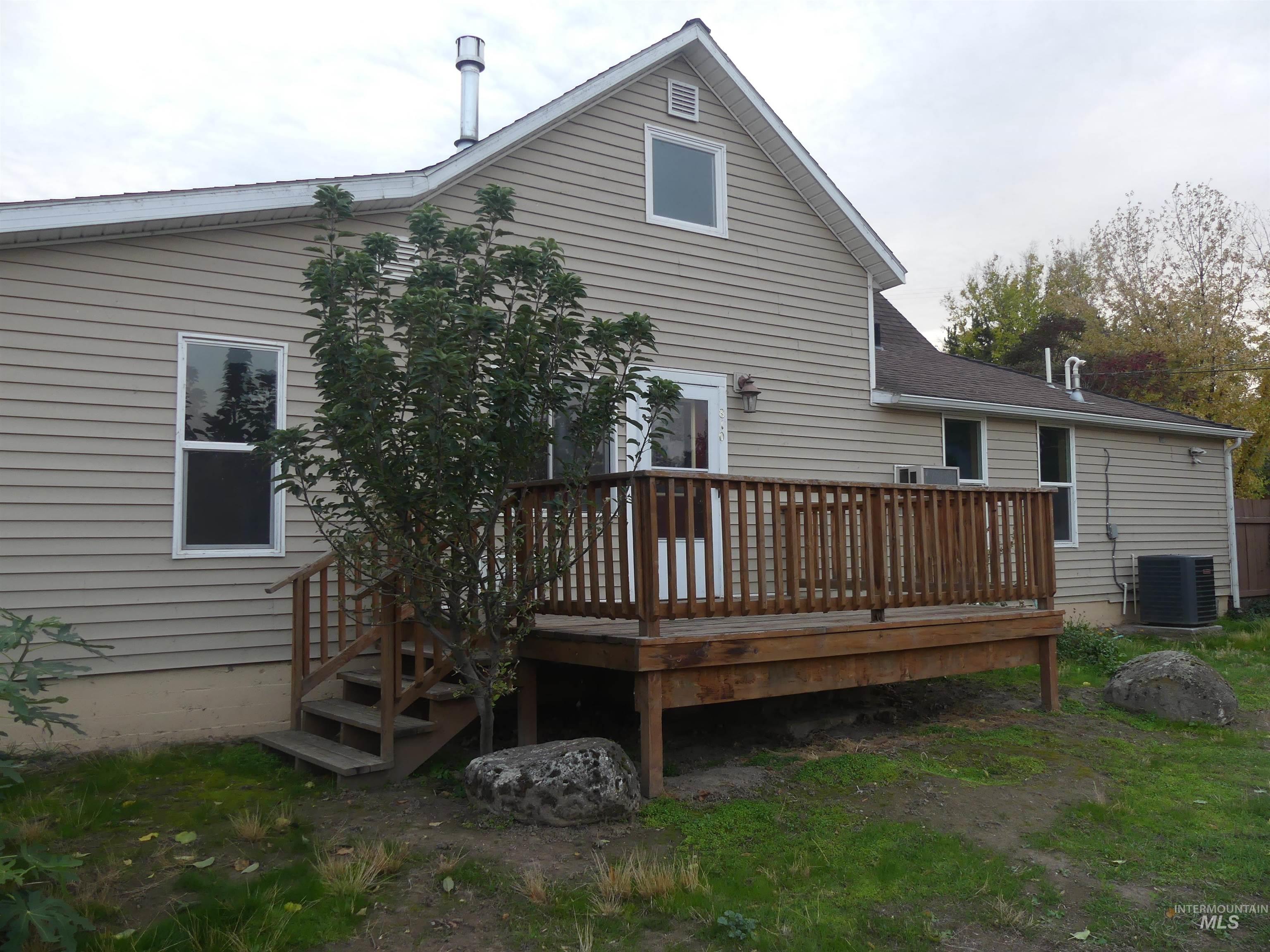 Rear view of property with a deck