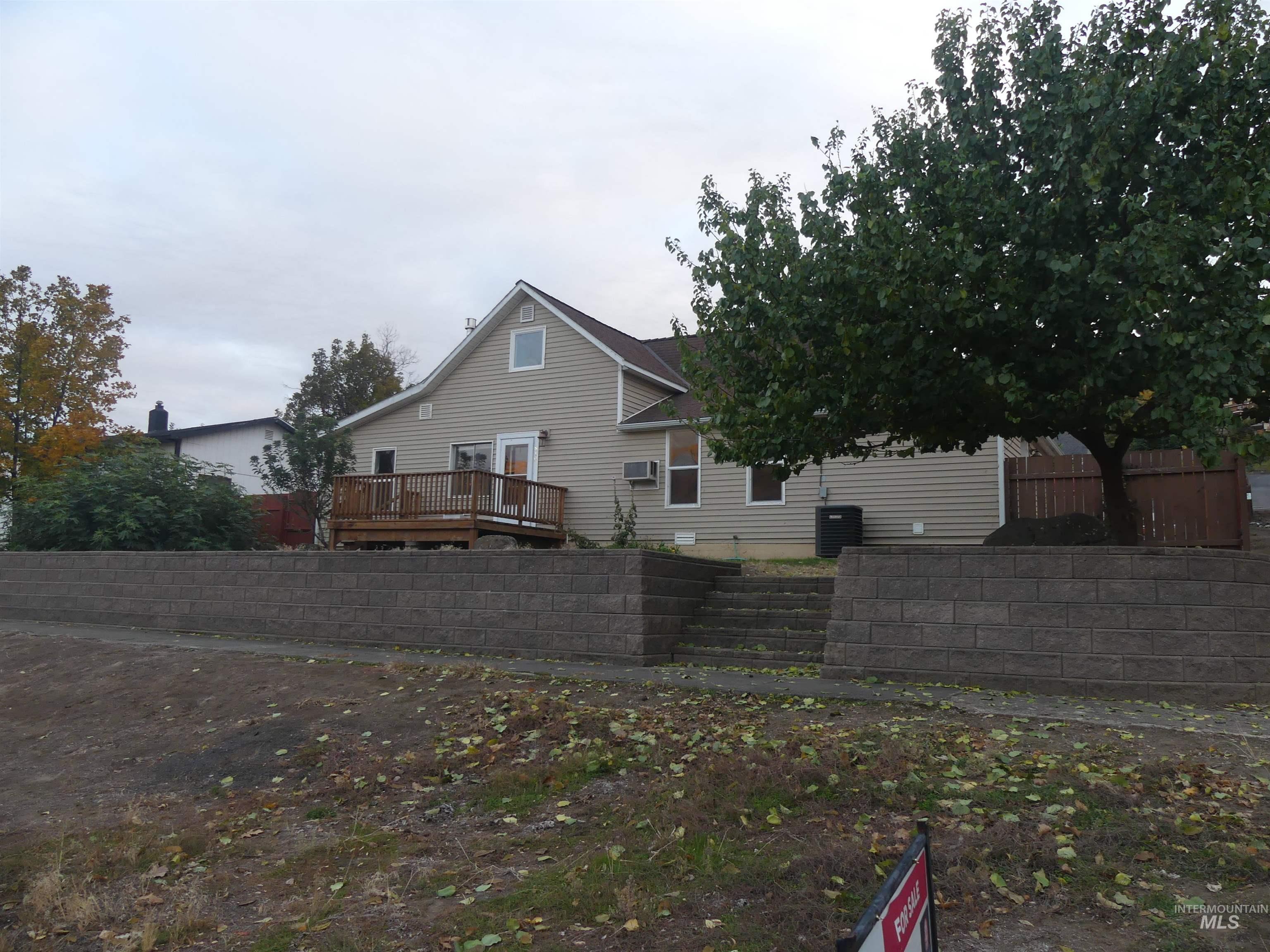 Back of house with a wooden deck