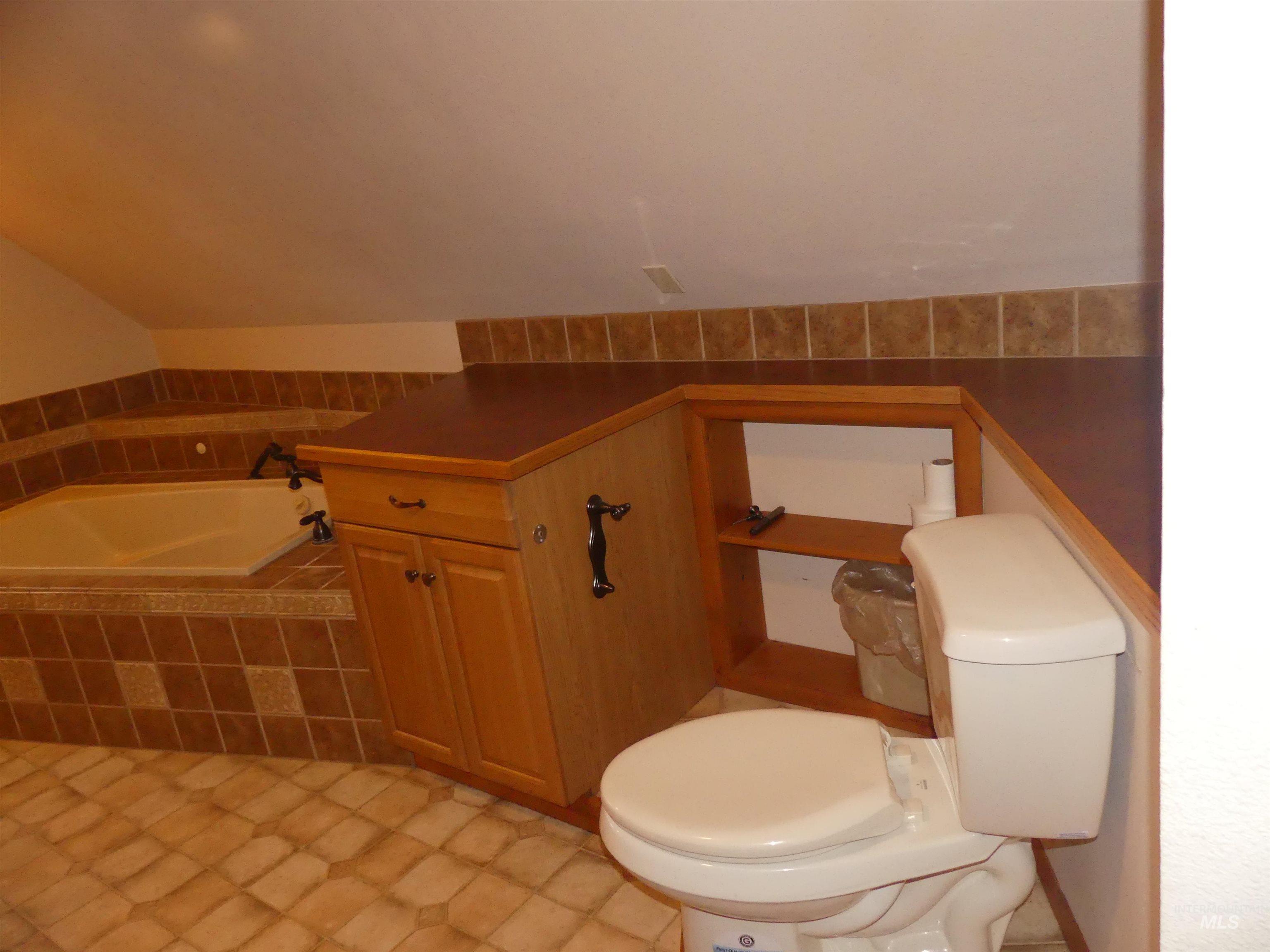 Bathroom with a bath and toilet