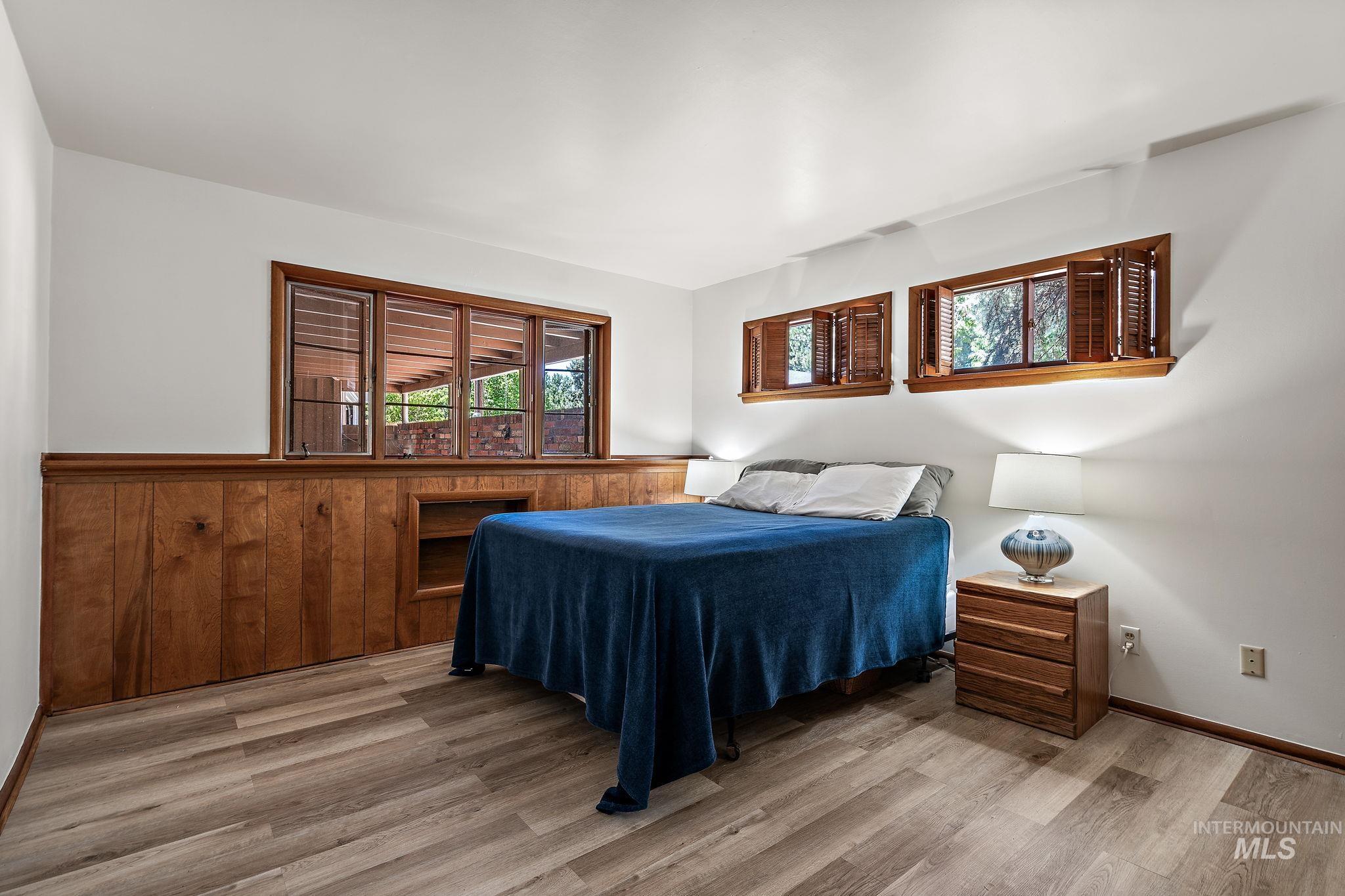 Bedroom featuring light wood-style flooring and baseboards