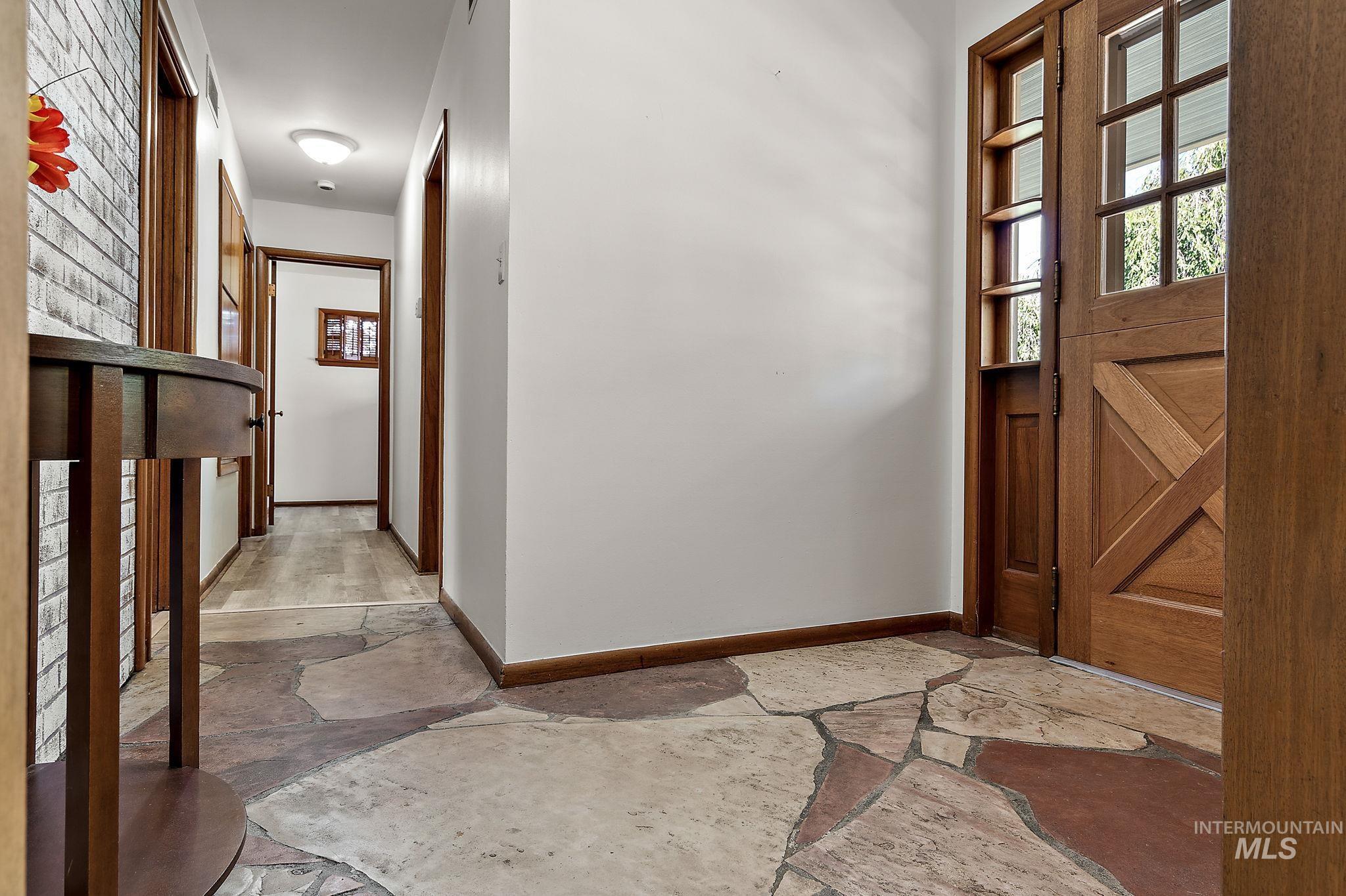 Foyer with stone tile floors