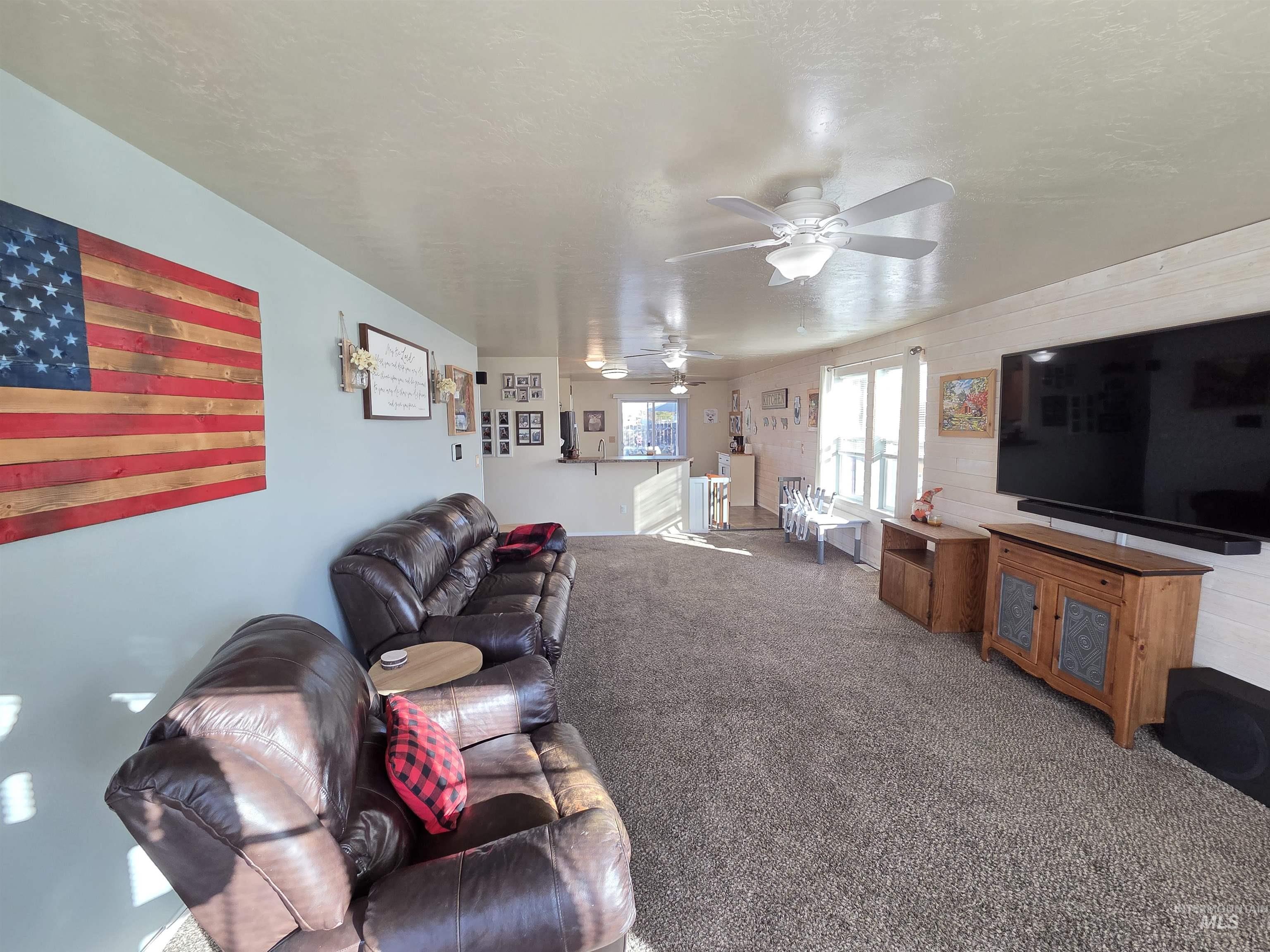 Living area with carpet flooring