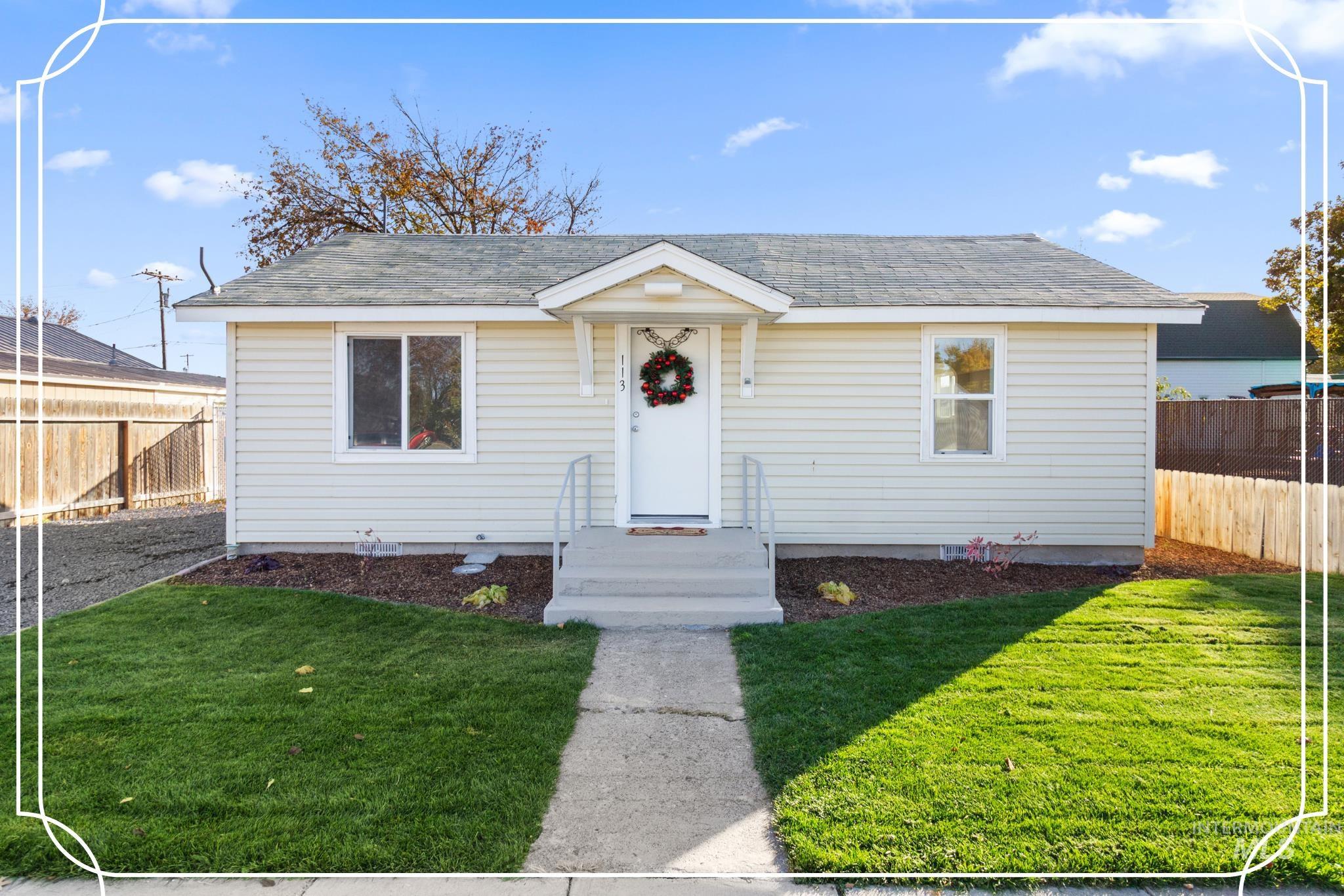 Bungalow-style home featuring a shingled roof