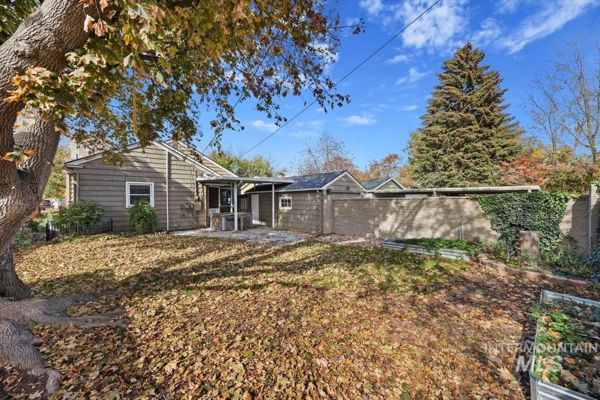 Back of house with a patio area