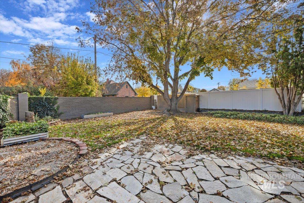 Fenced backyard featuring a patio area