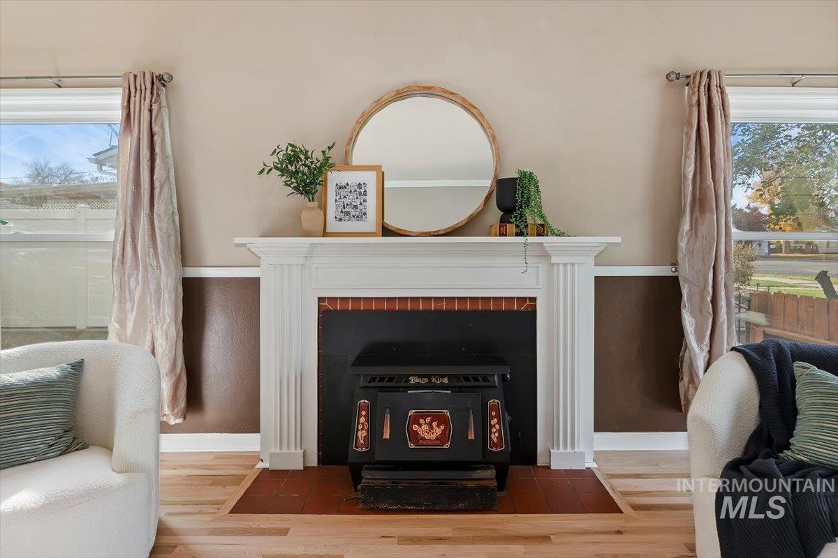 Detailed view of a wood stove and wood finished floors
